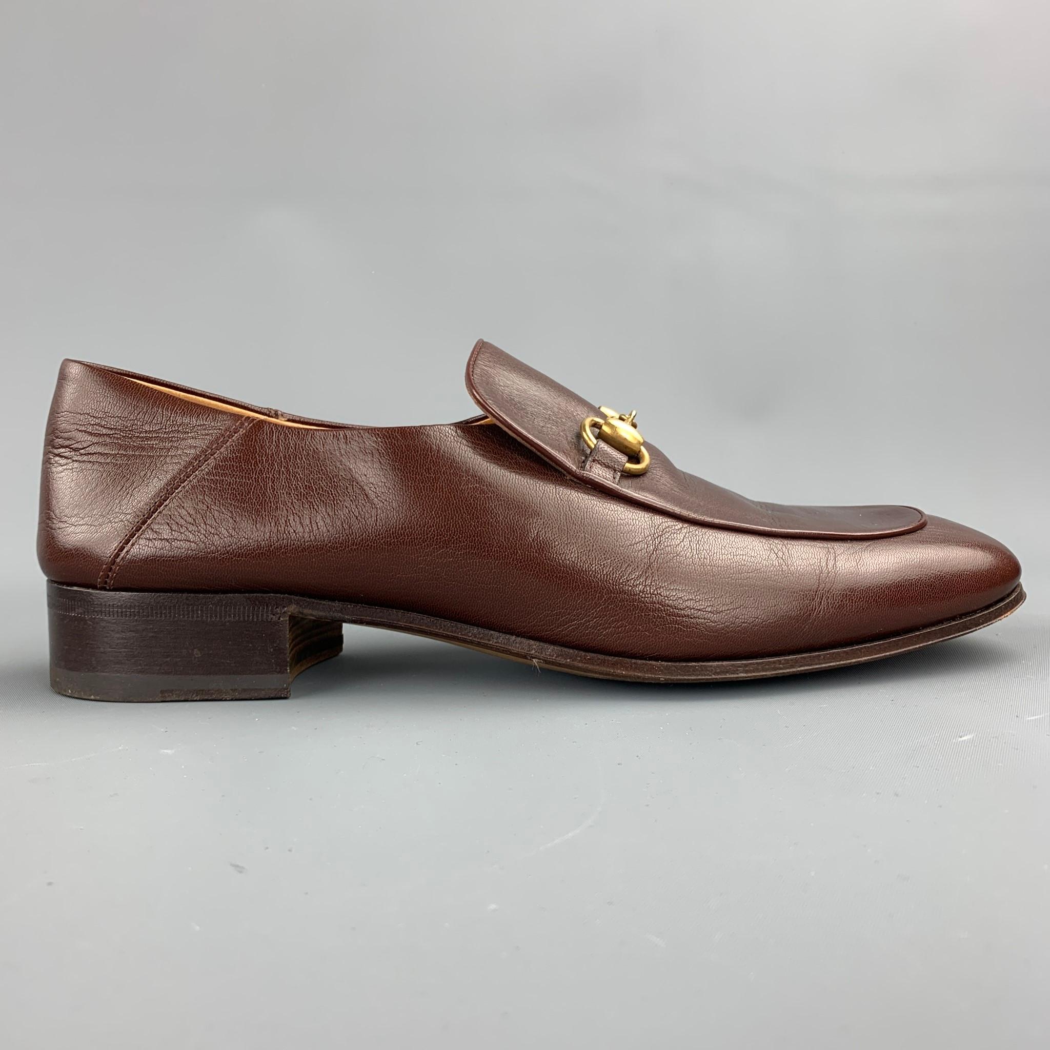 GUCCI loafers comes in a brown leather featuring a slip on style, front gold tone horsebit detail, and a wooden sole. Minor wear. Made in Italy.

Good Pre-Owned Condition.
Marked: 526297 10 13B

Outsole:

11.5 in. x 3.5 in. 