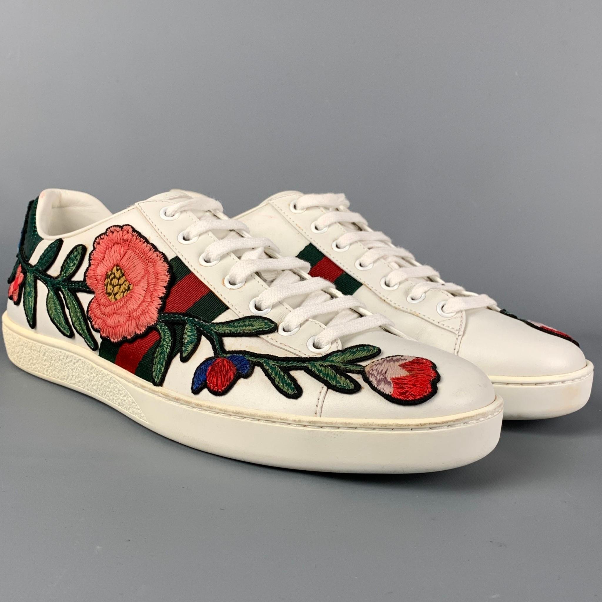 GUCCI sneakers comes in a multi-color leather featuring a floral embroidered design, signature stripe trim, rubber sole, and a lace up closure. Made in Italy. 

Very Good Pre-Owned Condition.
Marked: 431917 40 D
Original Retail Price: