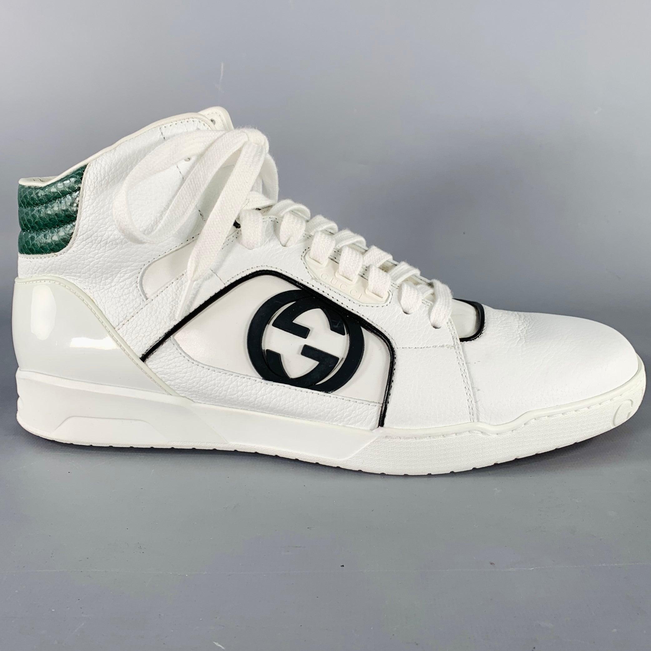 Vintage GUCCI sneakers
in a white leather featuring a high top style, green snakeskin print heel accent, and lace-up closure. Comes with box. Made in Italy.New with Box. 

Marked:   295322 9.5GOutsole: 11.5 x 4.25 inches 
  
  
 
Sui Generis
