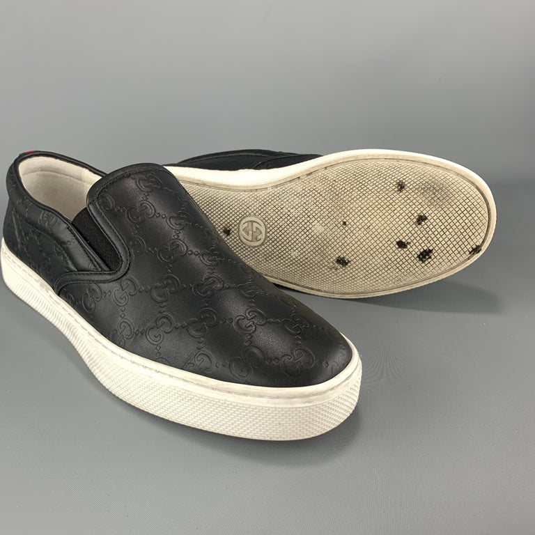 GUCCI Size 10.5 Black Monogram Embossed Leather Slip On Sneakers at 1stdibs
