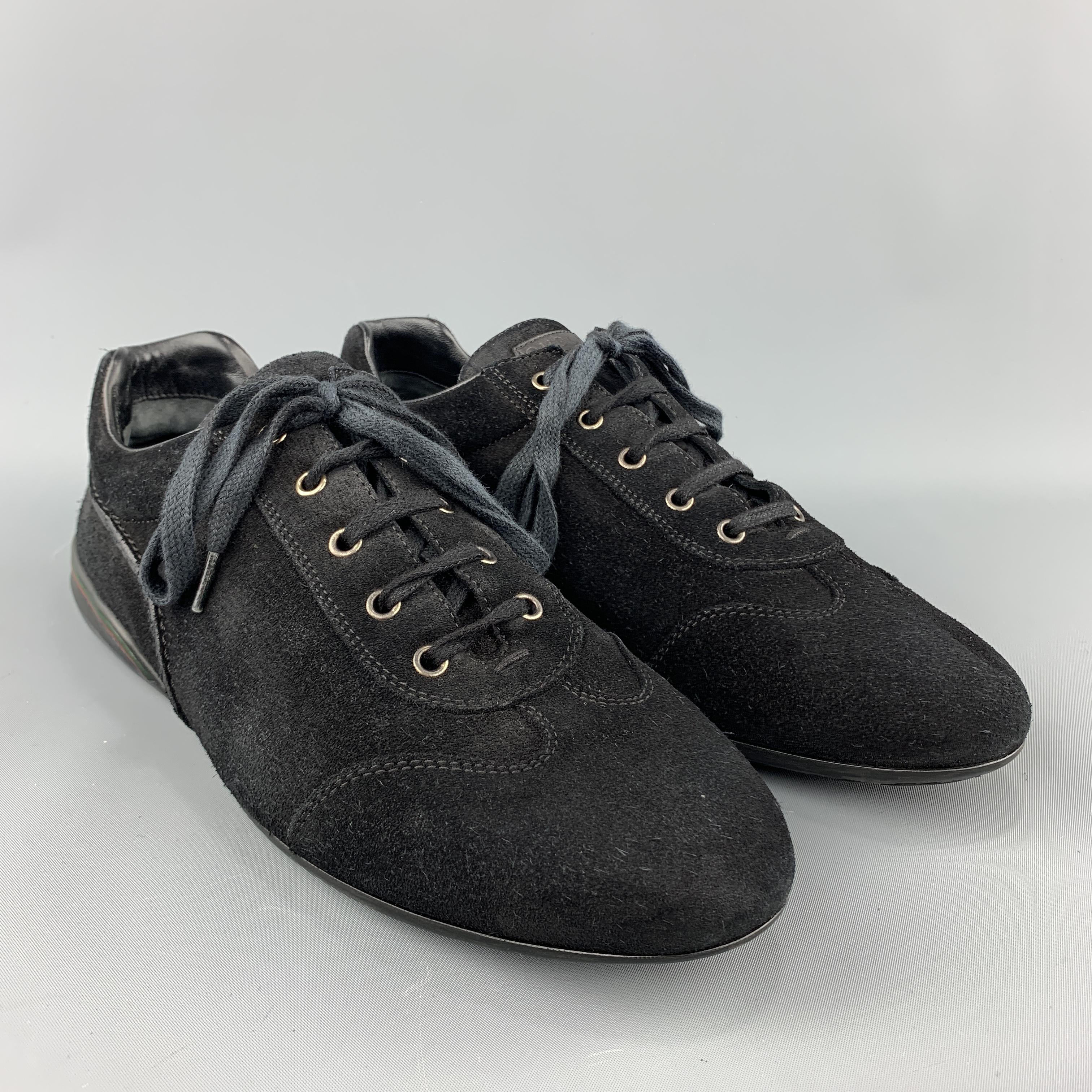 GUCCI trainers come in black suede with a toe panel, lace up front, and rubber sole with stripe accented heel. Made in Italy.
 
Very Good Pre-Owned Condition.
Marked: UK 9.5
 
Outsole:  12 x 4 in.
