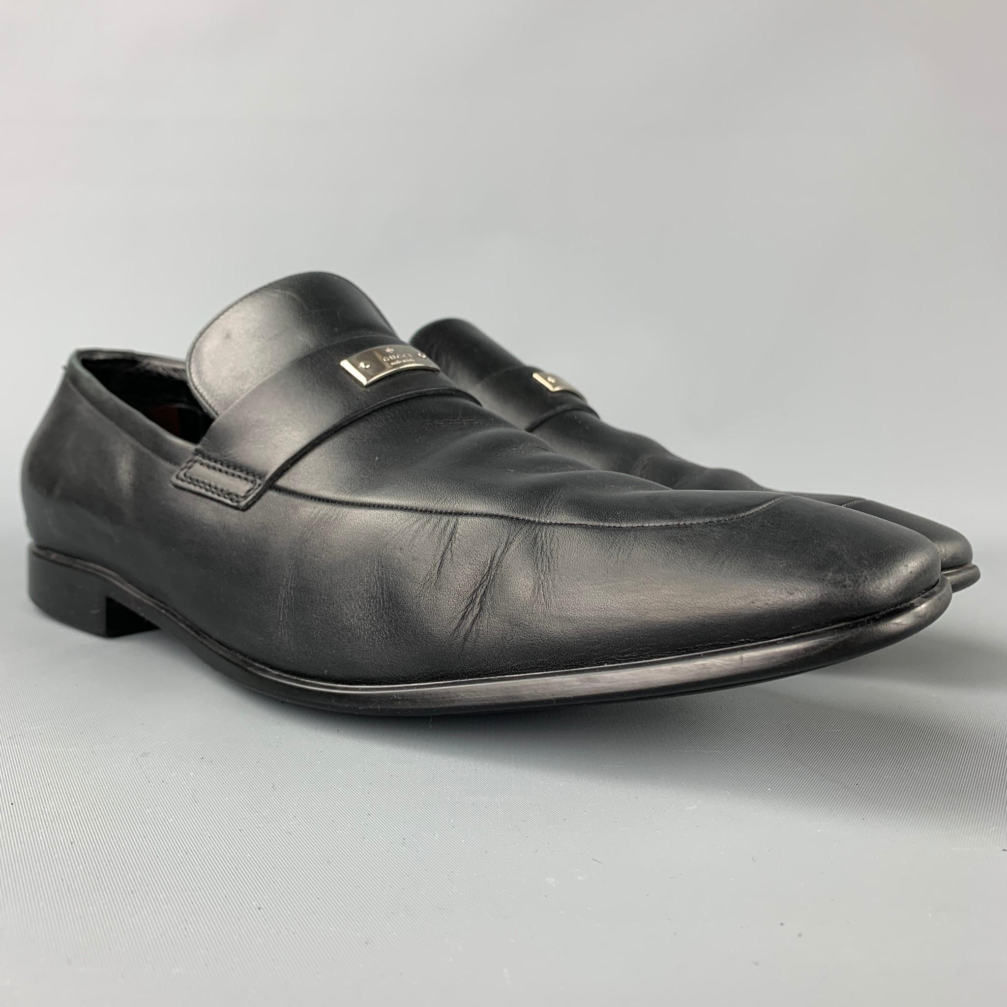 GUCCI loafers comes in a black leather with a silver tone logo detail featuring a slip on style, square toe, and a rubber sole. Made in Italy.

Good Pre-Owned Condition.
Marked: 147524 10.5 D

Outsole: 12 in. x 4 in. 