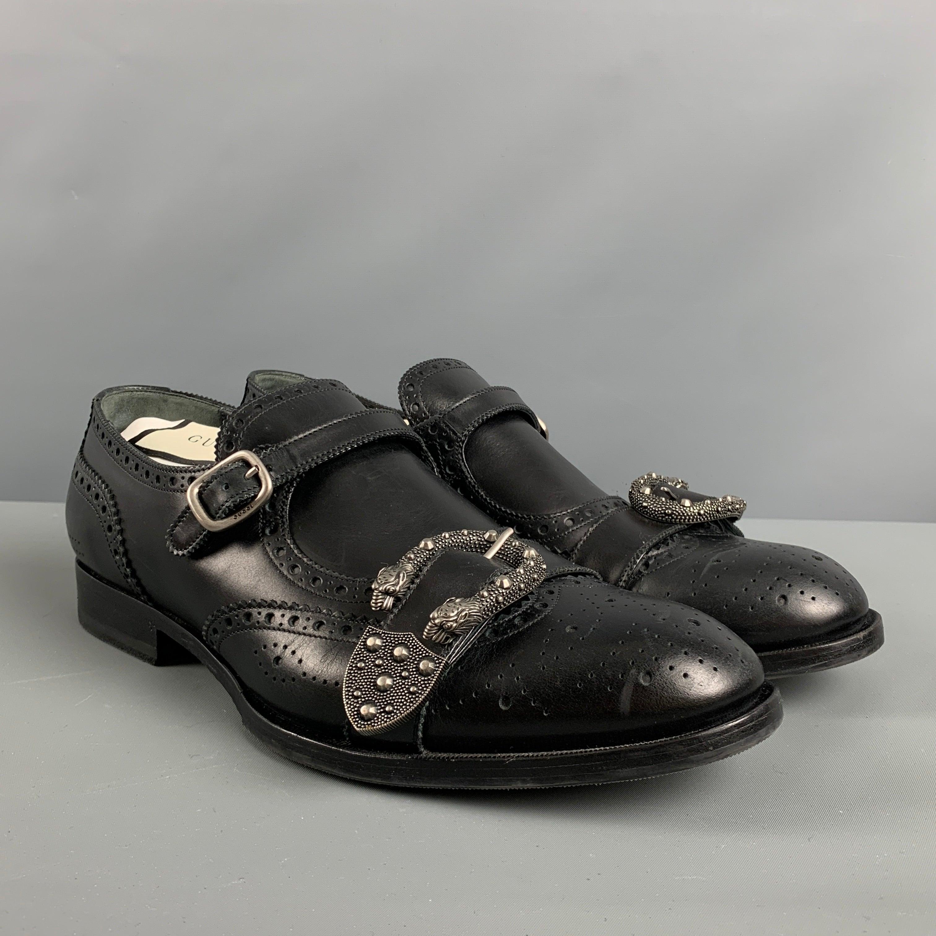 GUCCI loafers comes in a black perforated leather featuring a silver tone 