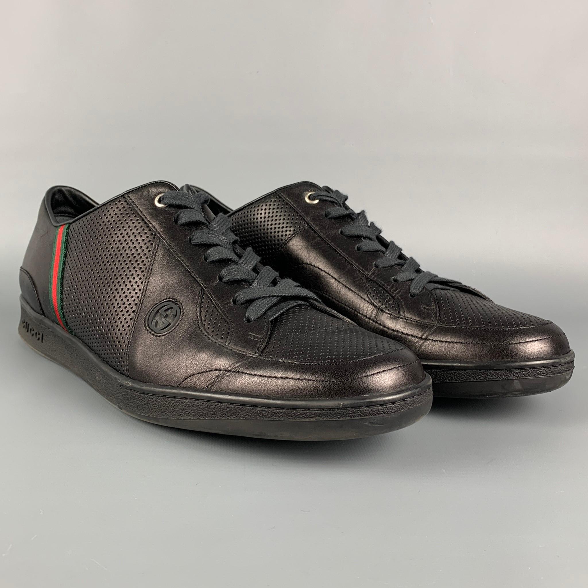 GUCCI sneakers comes in a black perforated leather featuring a low top style, signature stripe trim, and a lace up closure. Includes box. Made in Italy. 

Very Good Pre-Owned Condition.
Marked: 170573 12 G

Outsole: 12.5 in. x 4.25 in. 