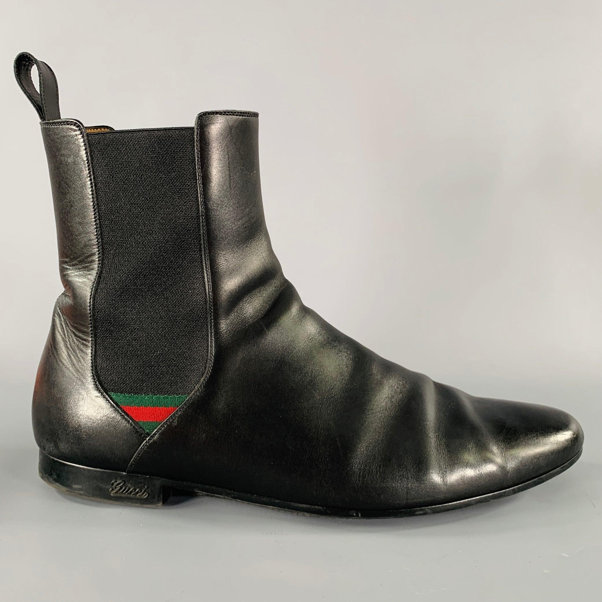 GUCCI boots
in a black leather fabric featuring a Chelsea style with elastic panels, signature ribbon detail, and pull on closure. Made in Italy.Very Good Pre-Owned Condition. Minor signs of wear. 

Marked:   268376 12 

Measurements: 
  Length: