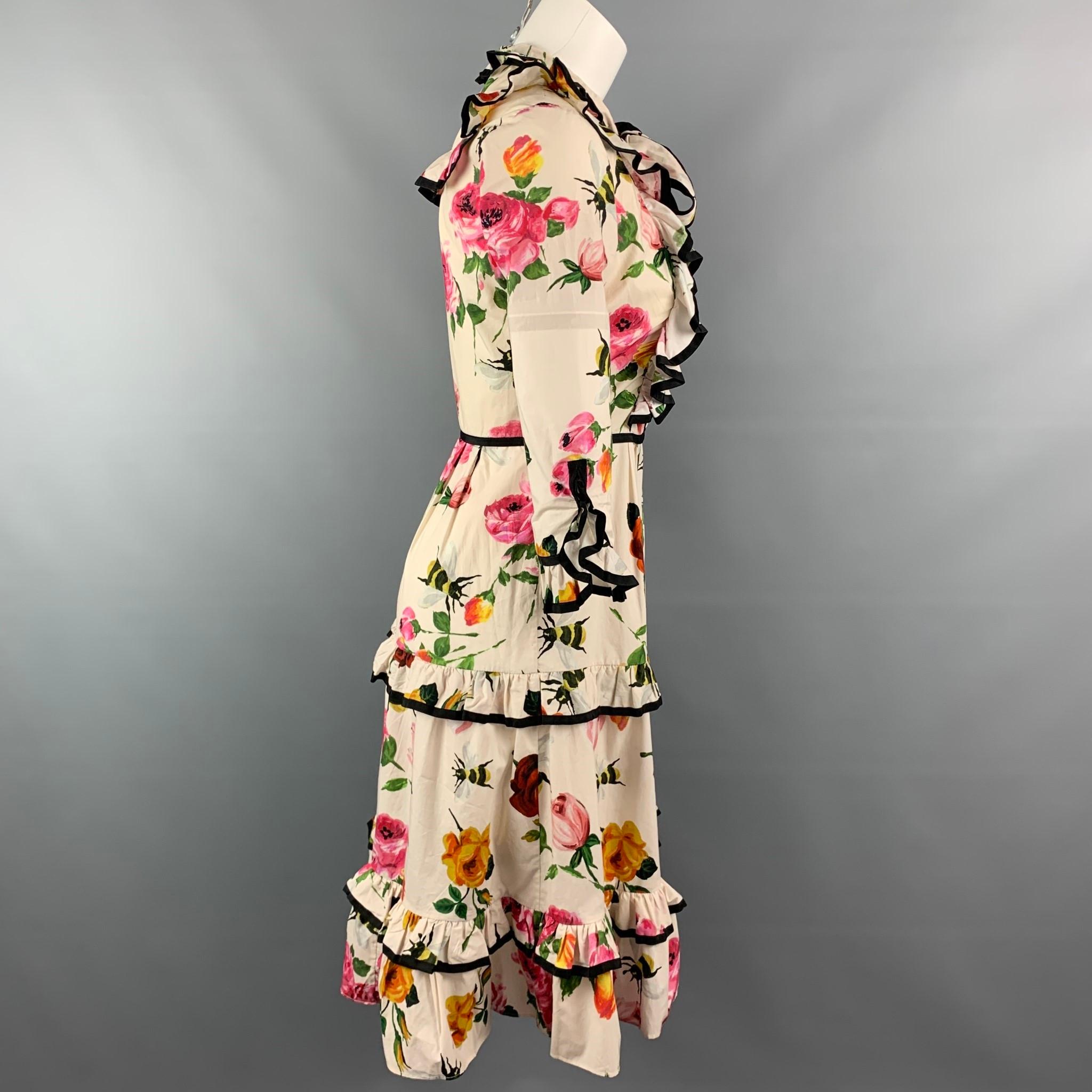 GUCCI cocktail dress comes in a beige floral cotton featuring pussy bow, ruffle details, black tipping, side zipper closure, and a faux pearl logo closure. Made in Italy.

Good Pre-Owned Condition. Minor discoloration and neckline & at front.