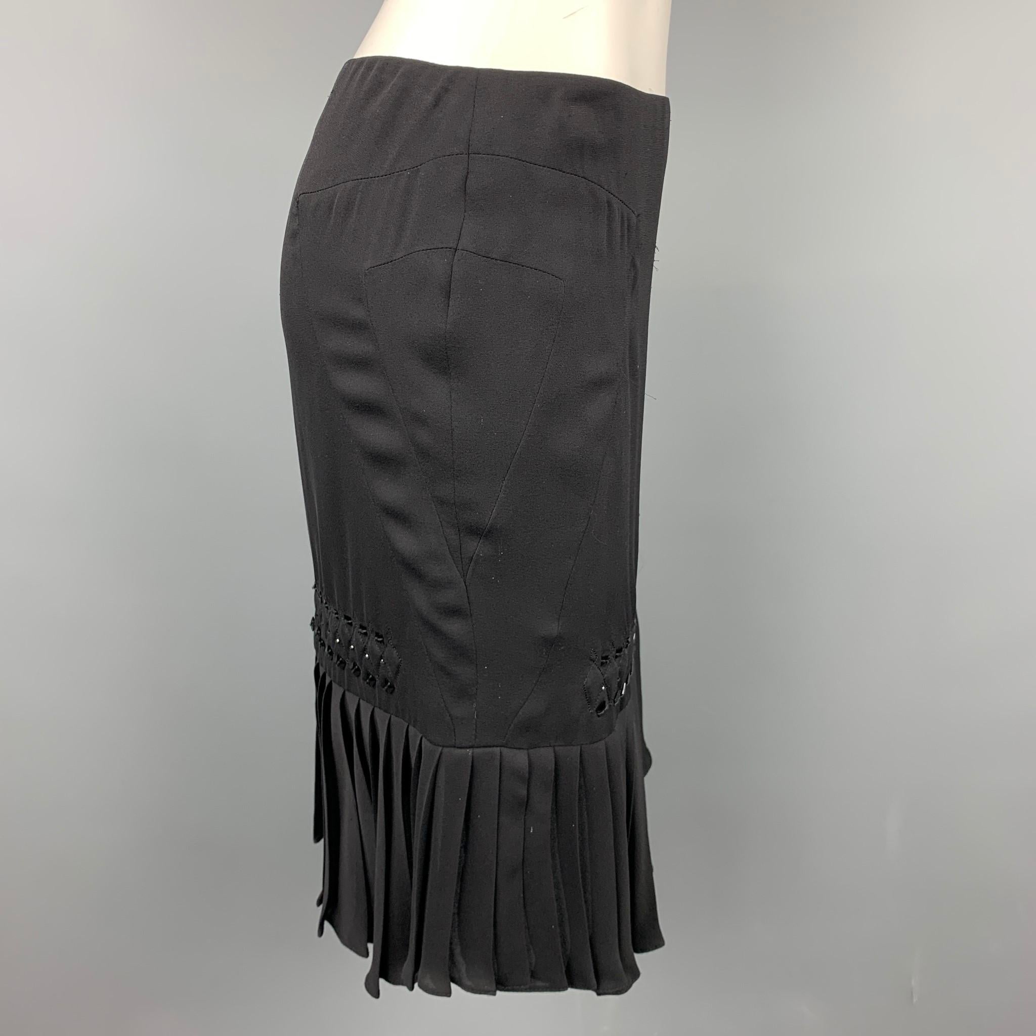 GUCCI skirt comes in a black silk with beaded details featuring a pleated style, top stitching, and a side zipper closure. Made in Italy.

Excellent Pre-Owned Condition.
Marked: IT 38

Measurements:

Waist: 28 in. 
Hip: 34 in.
Length: 21 in. 
