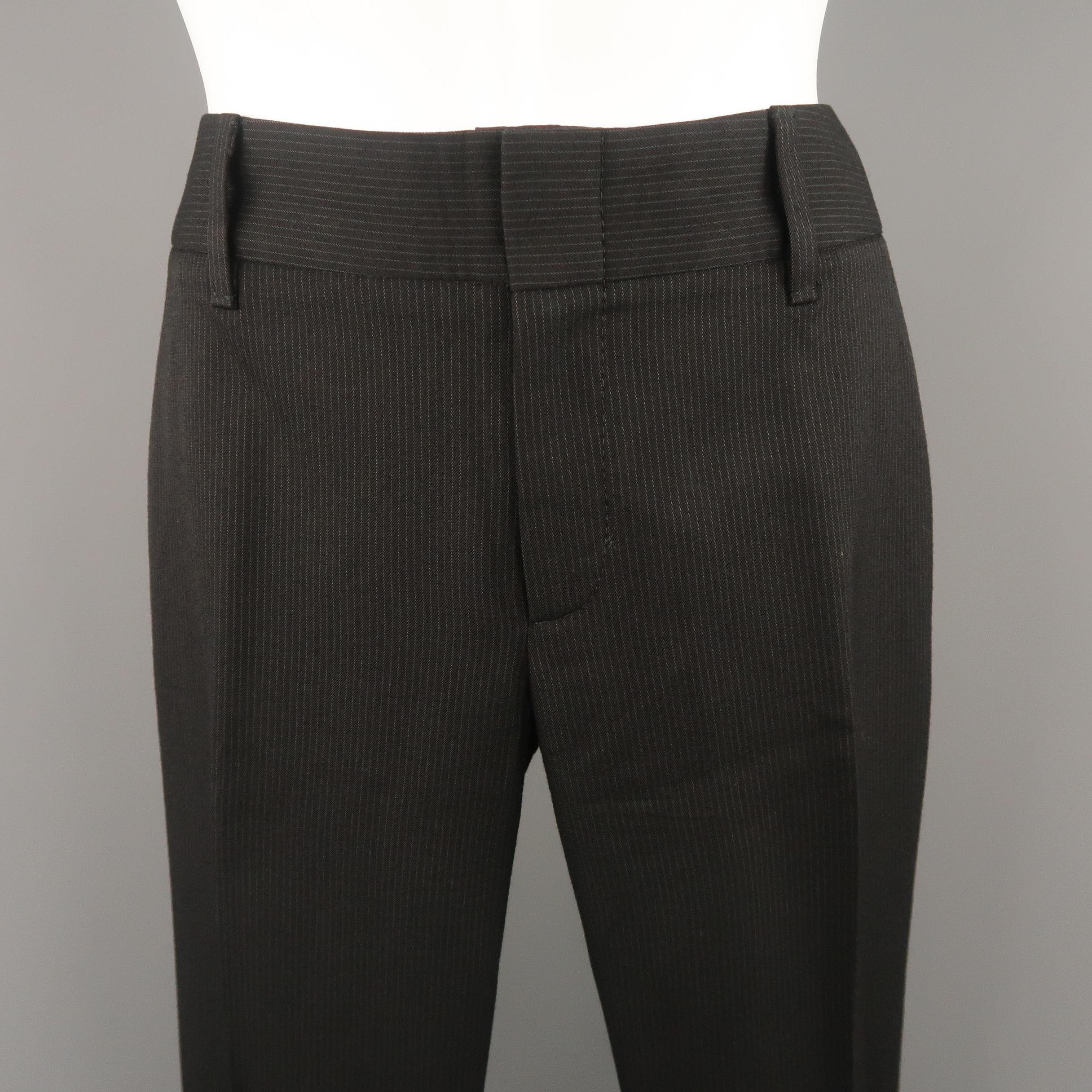 GUCCI dress pants come in black striped wool blend twill with a straight leg. Made in Italy.
 
Excellent Pre-Owned Condition.
Marked: IT 38
 
Measurements:
 
Waist: 30 in.
Rise: 8.5 in.
Inseam: 30 in.