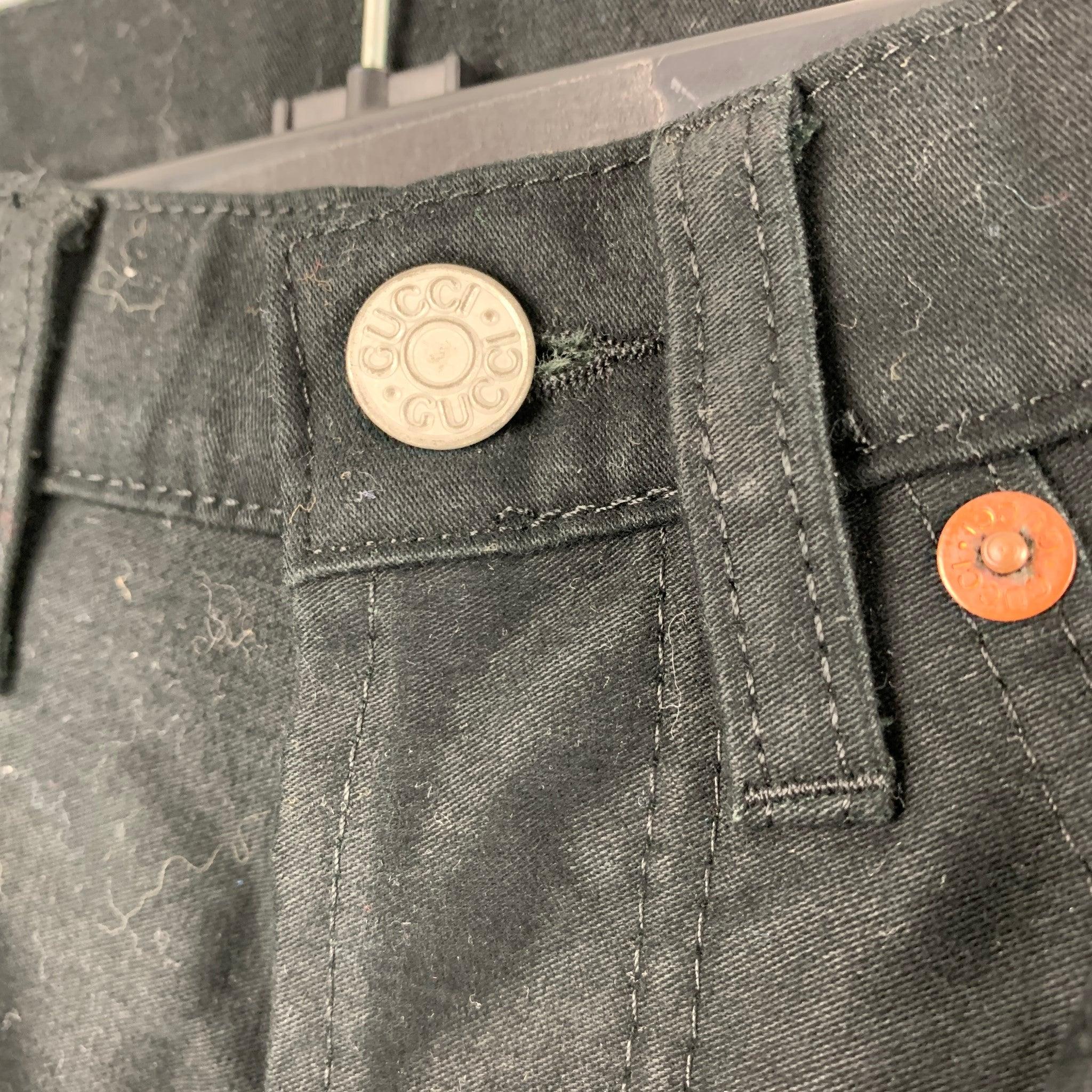 GUCCI jeans comes in a black cotton woven material featuring a wide leg, four pockets, bootcut style, and a button fly closure. Made in Italy. Very Good Pre-Owned Condition. 

Marked:   48 

Measurements: 
  Waist: 28 inches Rise: 8.5 inches Inseam: