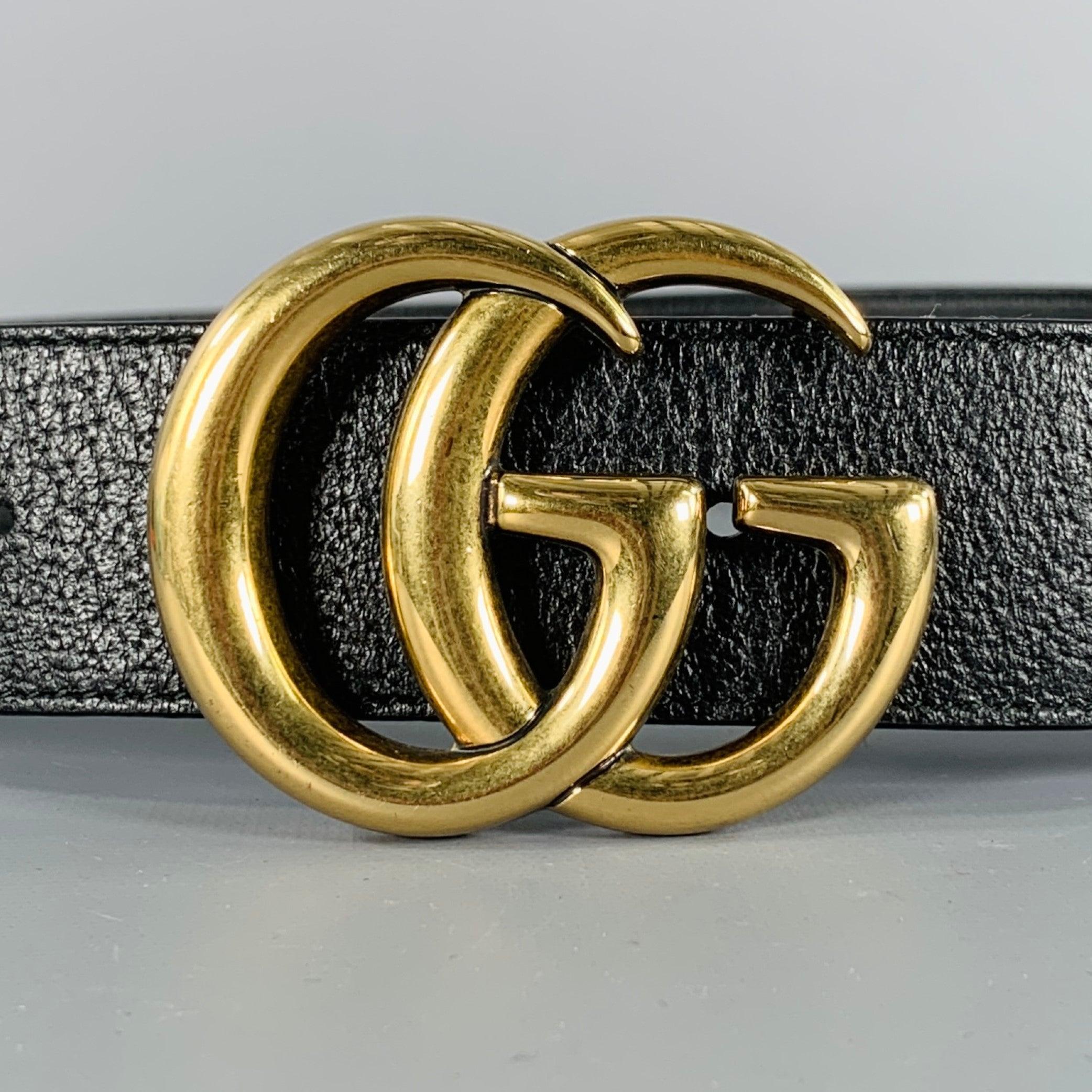GUCCI belt
in a black leather featuring a gold tone double GG monogram buckle. Note: this GUCCI buckle is attached to an unbranded leather belt. Made in Italy.Very Good Pre-Owned Condition. 

Marked:   size not marked on unbranded beltLength: 37.5