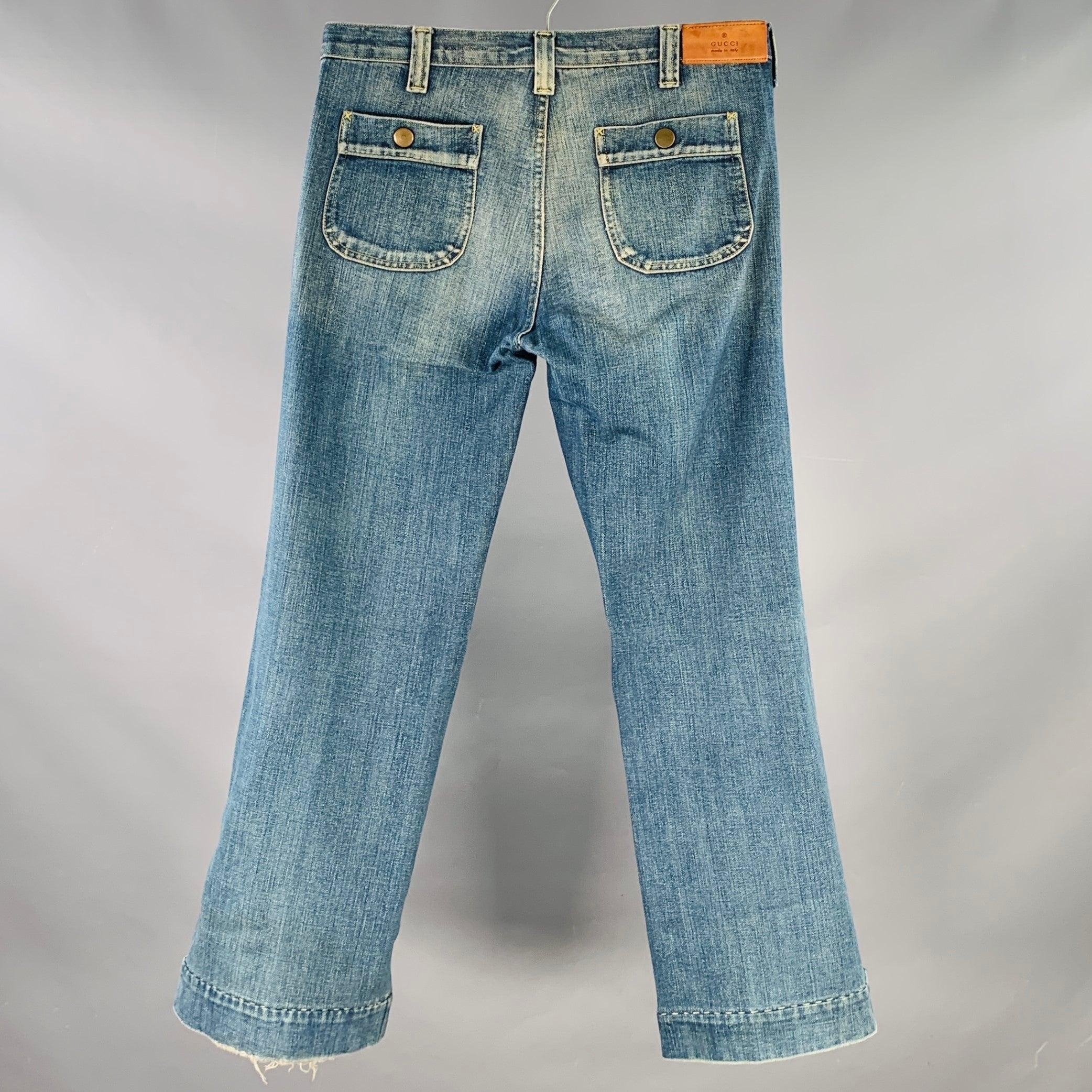 GUCCI jeans
in a blue wash cotton selvedge denim featuring yellow contrast stitching, wide straight leg, and zip fly closure. Made in Italy.Excellent Pre-Owned Condition.  

Marked:   IT 48 

Measurements: 
  Waist: 32 inches Rise: 9 inches Inseam: