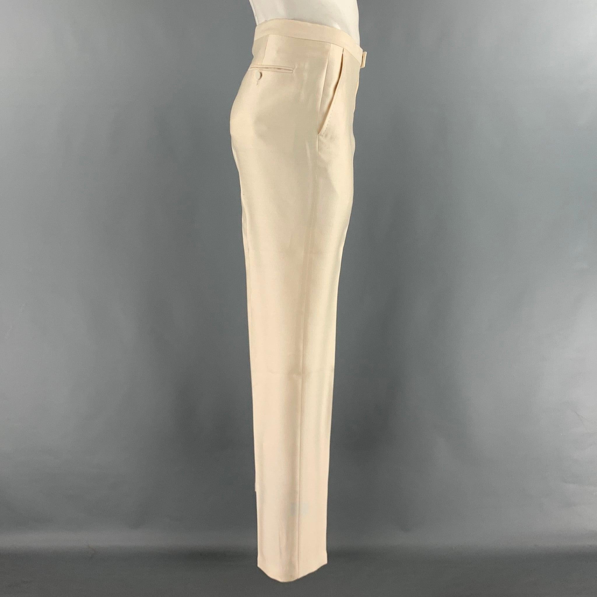 GUCCI dress pants in a beige wool and silk woven featuring flat front style, front tabs, and zip fly closure. Made in Italy.Excellent Pre-Owned Condition. 

Marked:   IT 50 R 

Measurements: 
  Waist: 34 inches Rise: 9 inches Inseam: 33.5 inches  
 