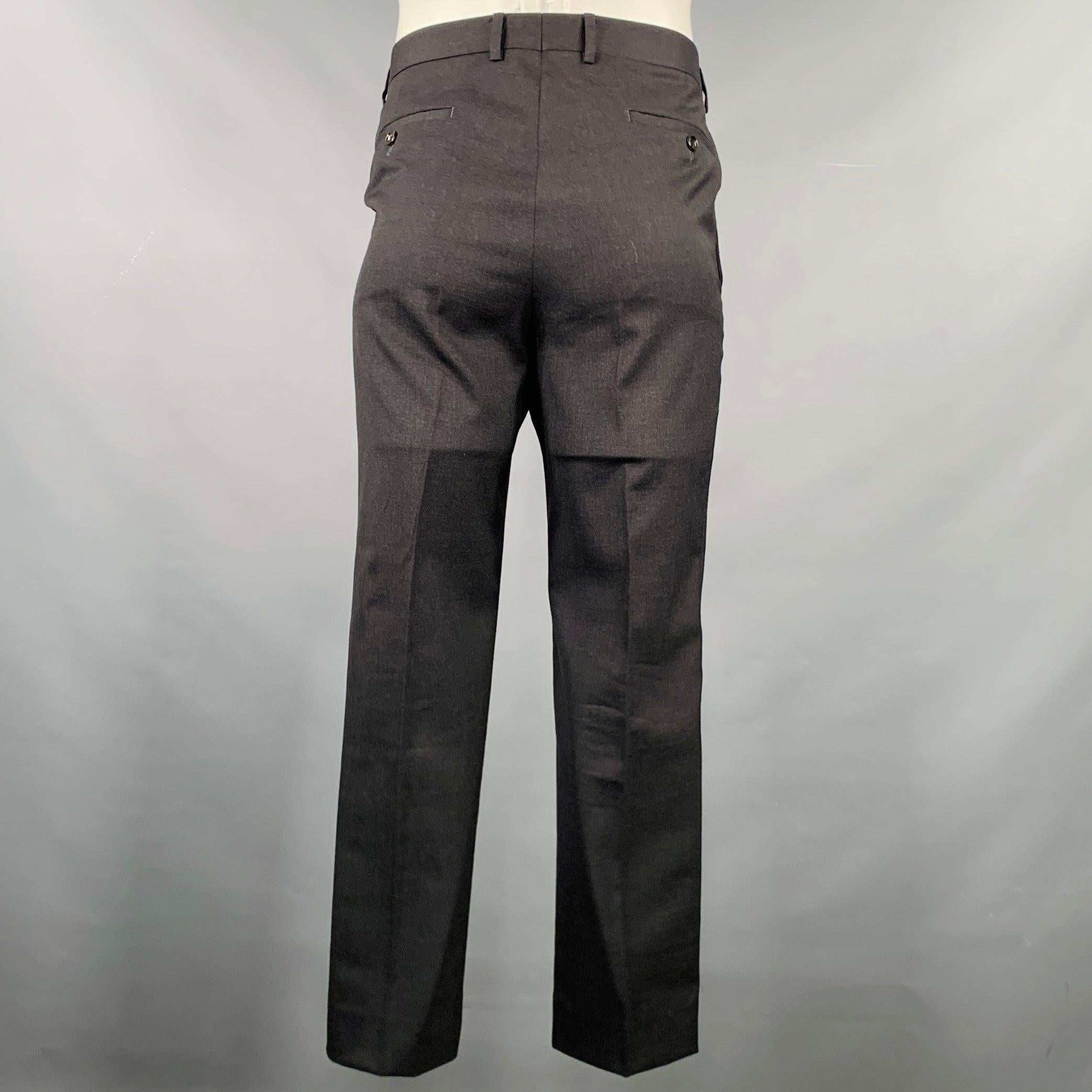 GUCCI dress pants
in a charcoal grey wool stretch blend fabric featuring a flat front style, straight leg, and zip fly closure. Made in Italy.Excellent Pre-Owned Condition. 

Marked:   50 

Measurements: 
  Waist: 34 inches Rise: 9 inches Inseam: 29
