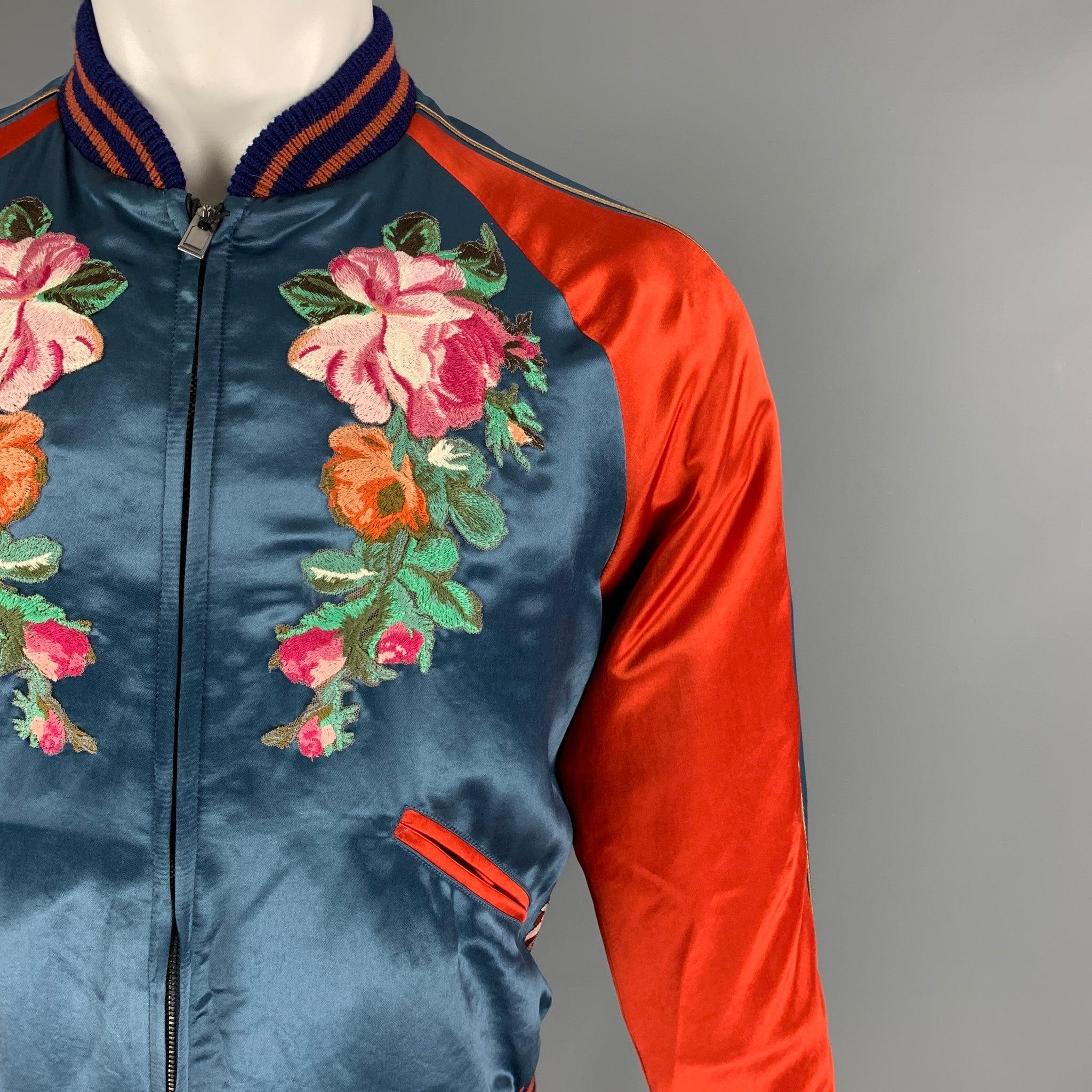 GUCCI by Alessandro Michele jacket comes in a multi-color satin acetate featuring a varsity bomber style, front floral embroidery, ribbed hem, back floral & japanese koi carp embroidery, raglan sleeves, slit pockets, and a full zip up closure. Made