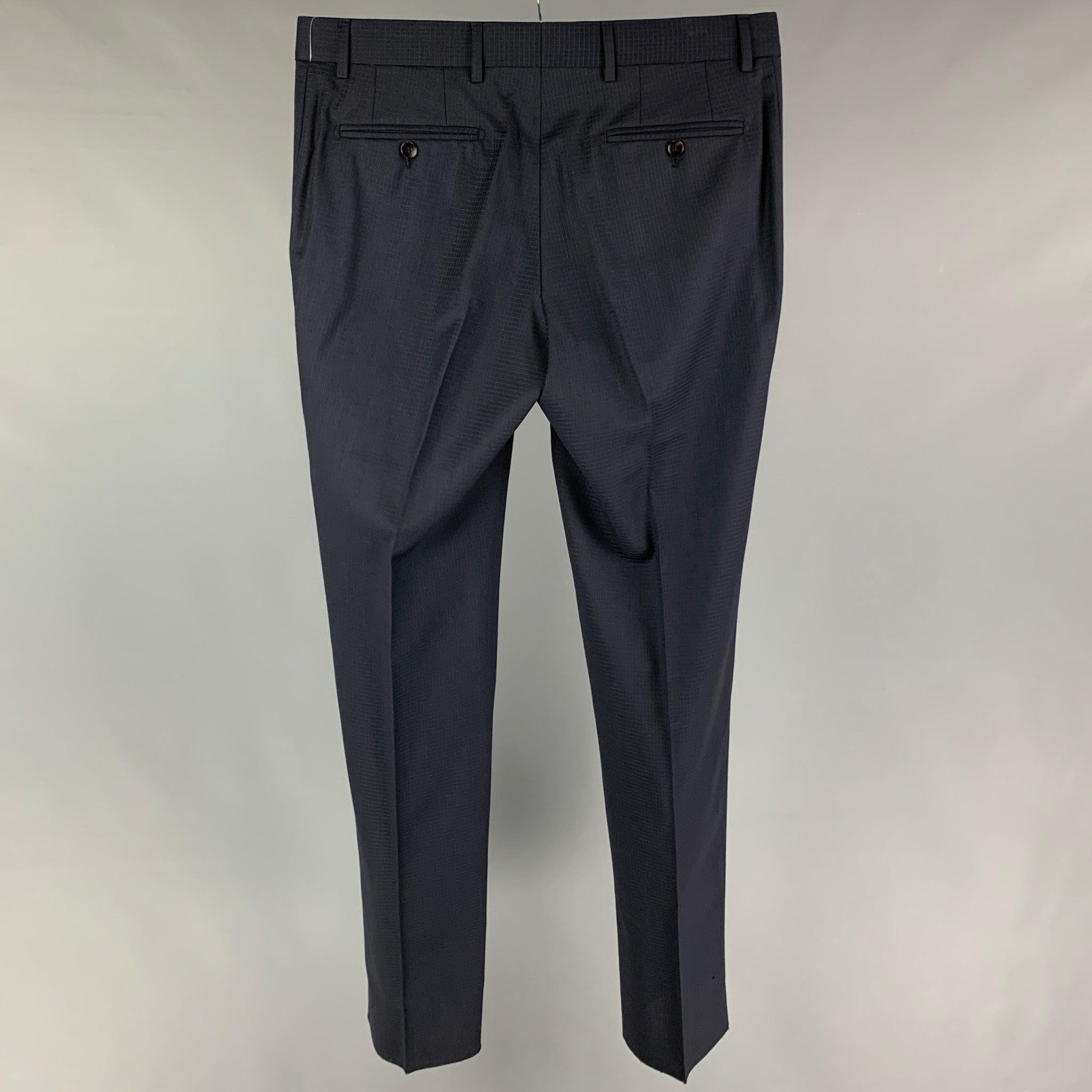 GUCCI dress pants comes in a navy checkered wool featuring a flay front, front tab, and a zip fly closure.
 Excellent
 Pre-Owned Condition. 
 

 Marked:  50 R  
 

 Measurements: 
  Waist: 36 inches Rise: 9 inches Inseam: 36 inches 
  
  
  
 Sui