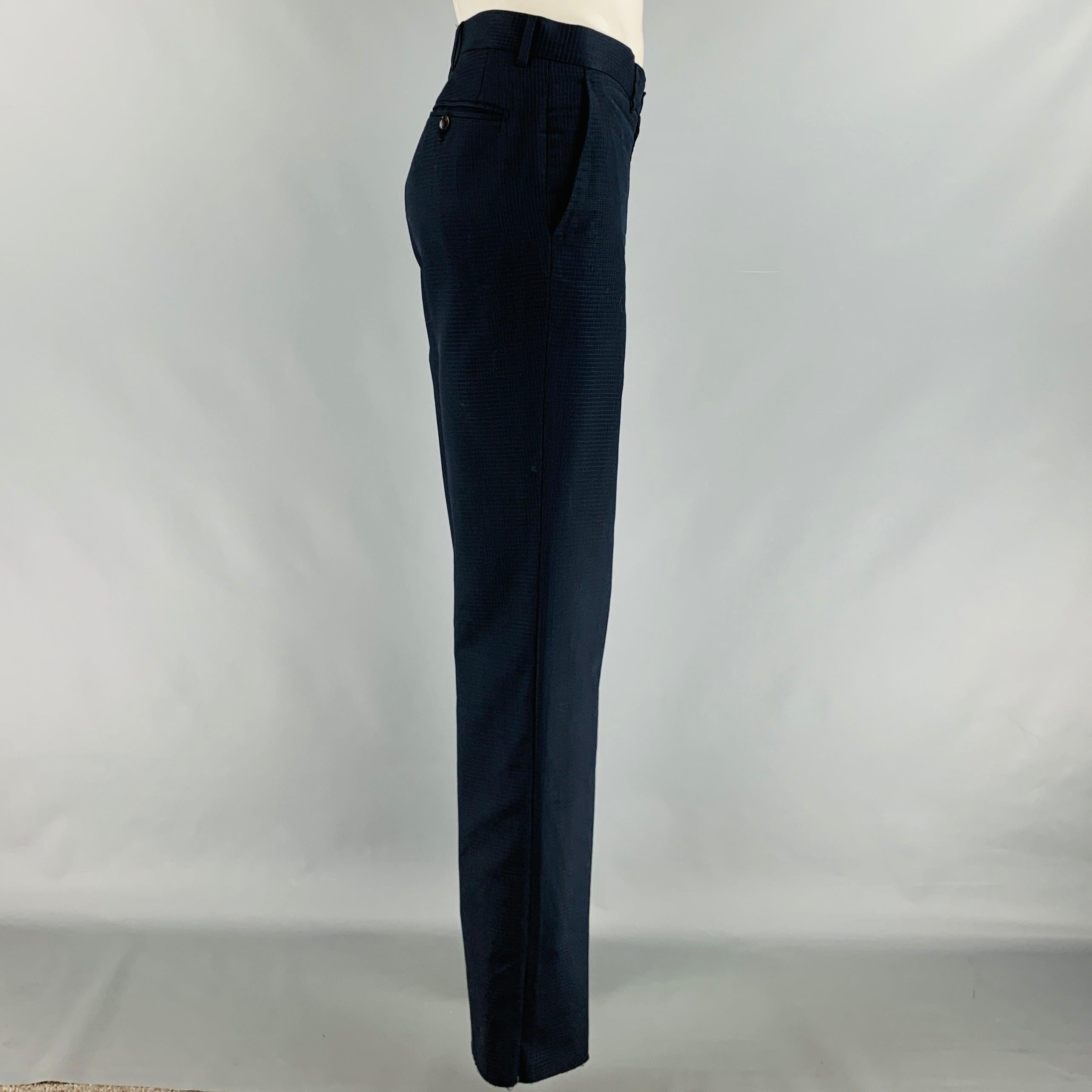 GUCCI casual pants in a navy wool fabric featuring flat front style, unfinished hem, and zip fly closure. Made in Italy.Very Good Pre-Owned Condition. Minor mark. 

Marked:   IT 50 

Measurements: 
  Waist: 34 inches Rise: 8 inches Inseam: 36 inches