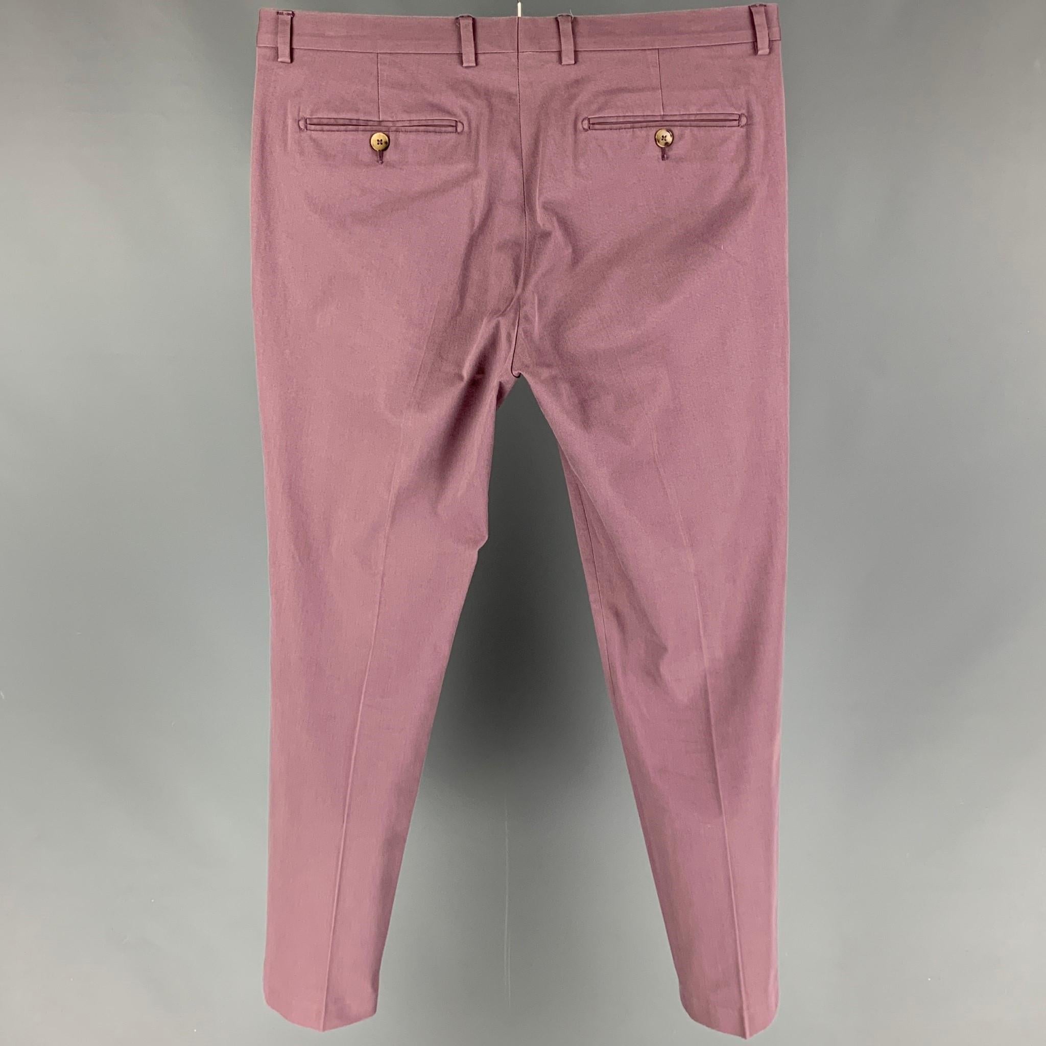 GUCCI pants comes in a purple cotton featuring a flat front, slim fit, front tab, and a zip fly closure. 

Very Good Pre-Owned Condition. Fabric tag removed.
Marked: Size tag removed.

Measurements:

Waist: 35 in.
Rise: 9.5 in.
Inseam: 31 in. 