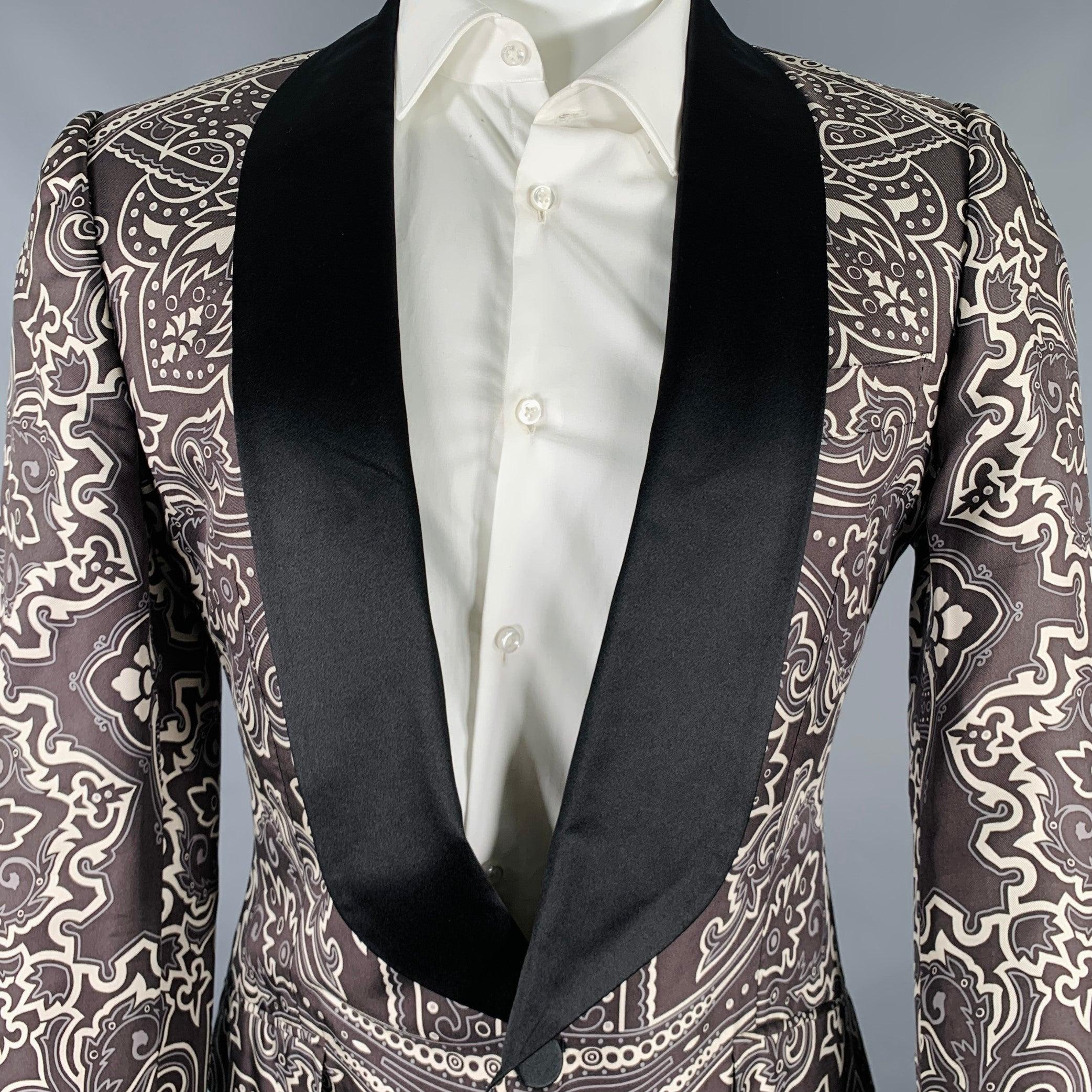 Vintage GUCCI by TOM FORD SS2004 sport coat
in a black and grey wilk fabric featuring a graphic pattern, shawl lapel, double vented back, and single button closure.Very Good Pre-Owned Condition. Minor signs of wear. 

Marked:   48 

Measurements: 
