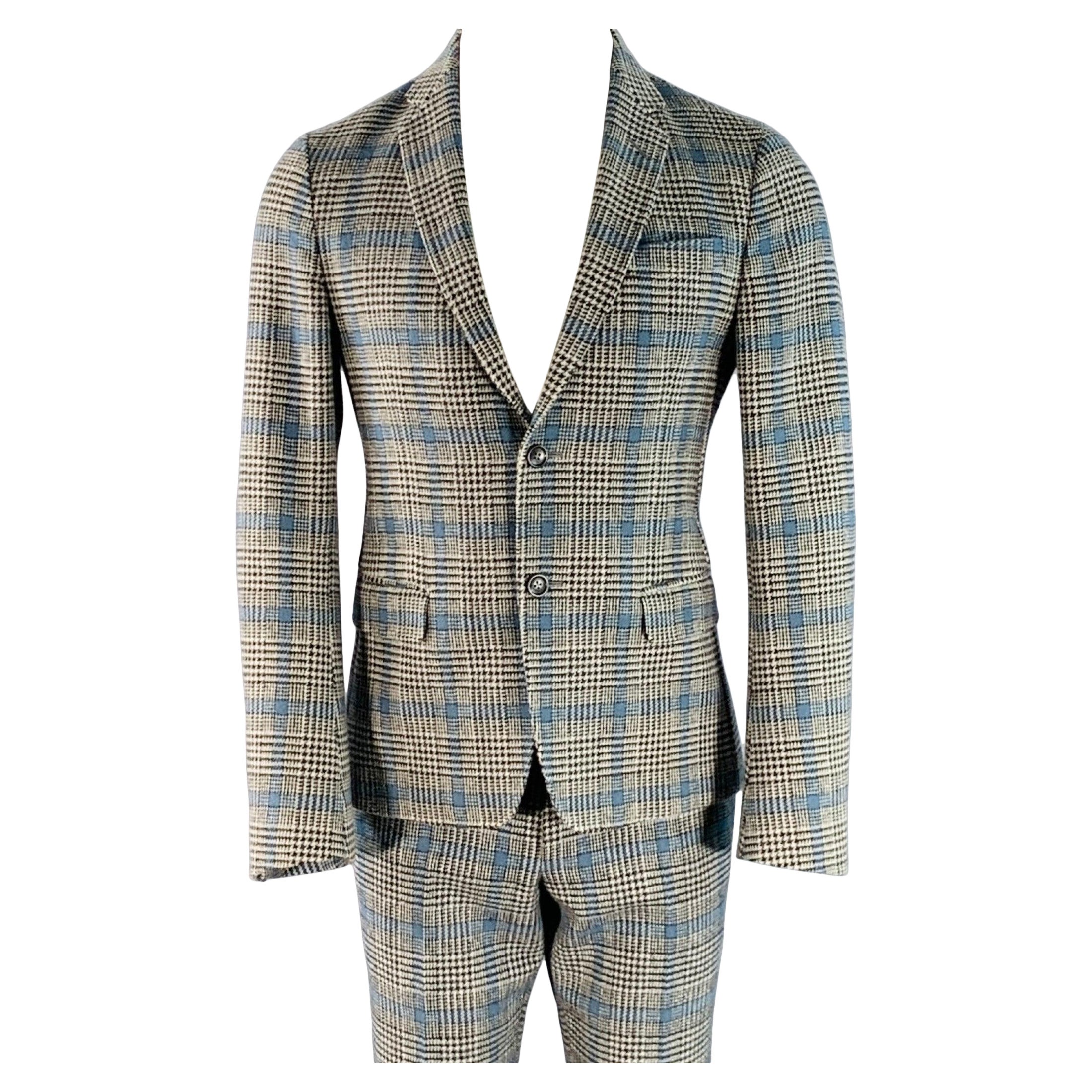 Gucci taglia 38, nero, bianco, blu, abito in lana con risvolto a tacche.