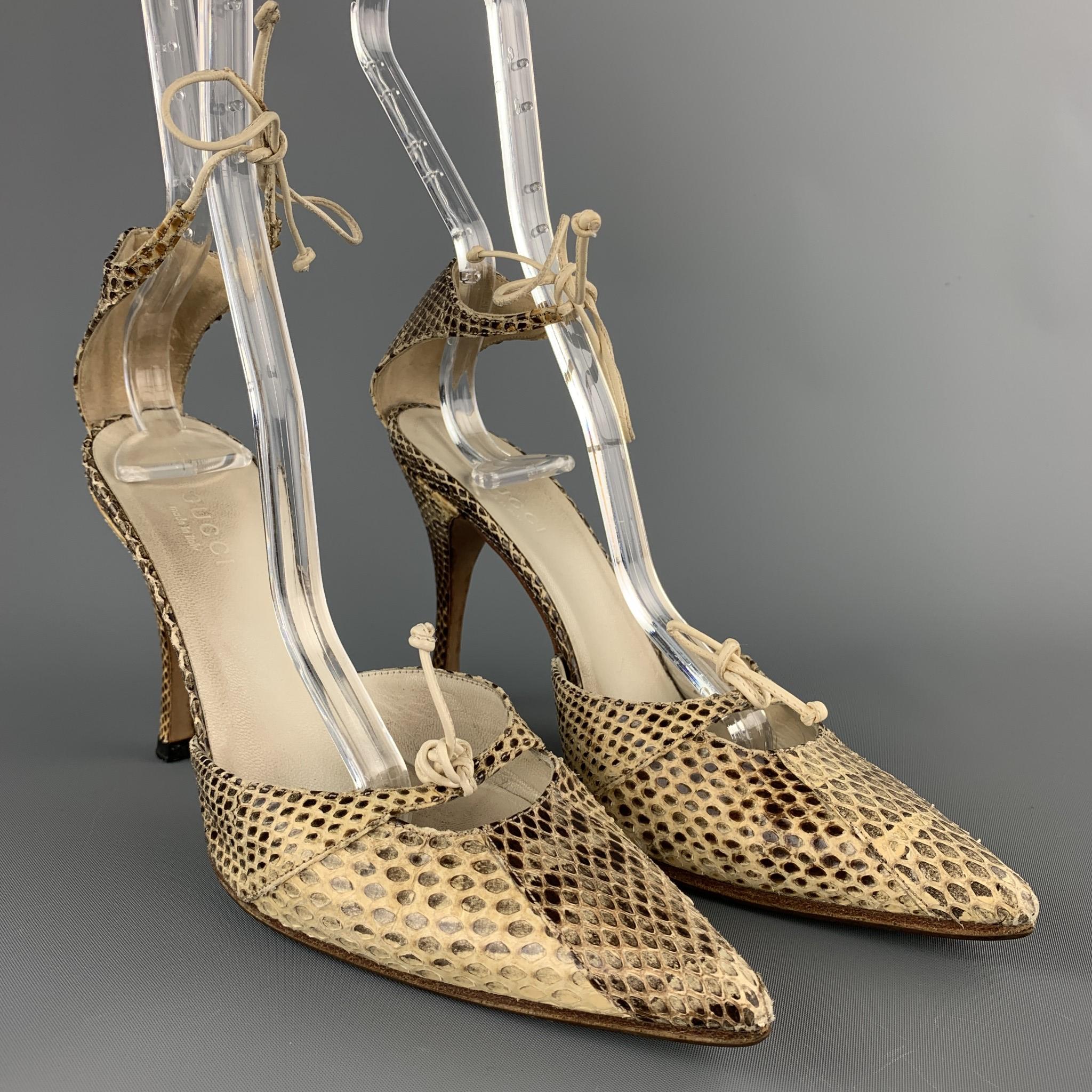 GUCCI pumps comes in a beige snake skin featuring a pointed toe, front strap detail, and a ankle strap closure. Wear throughout. As-Is. Made in Italy.

Good Pre-Owned Condition.
Marked: IT 34 C 

Measurements:

Heel: 3.5 in. 
