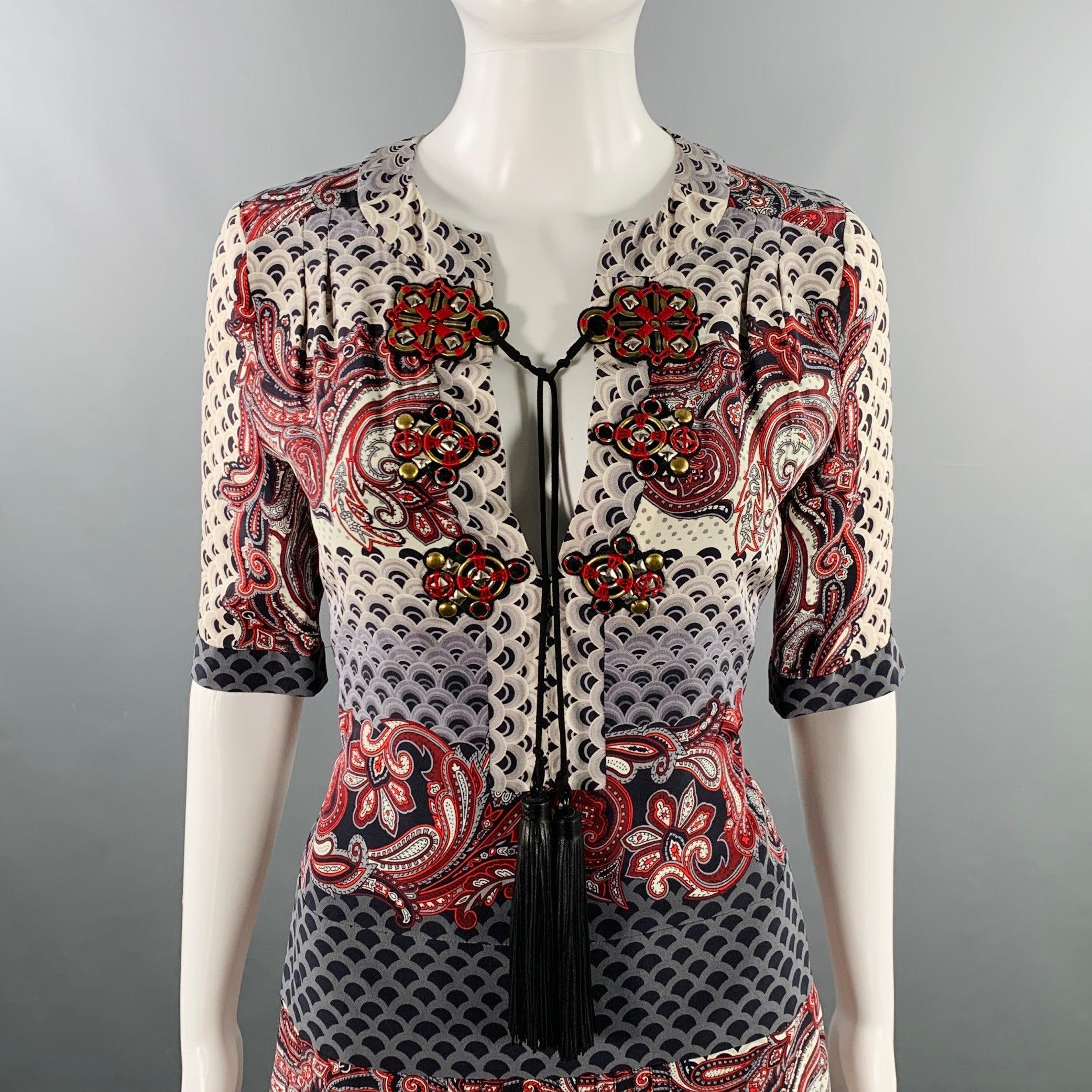 GUCCI dress
in a multi-color silk featuring an Asian-inspired wave pattern with red paisley details, brass metal hardware with leather tassel details, and back zipper closure. Made in Italy.Excellent Pre-Owned Condition. 

Marked:   IT 40