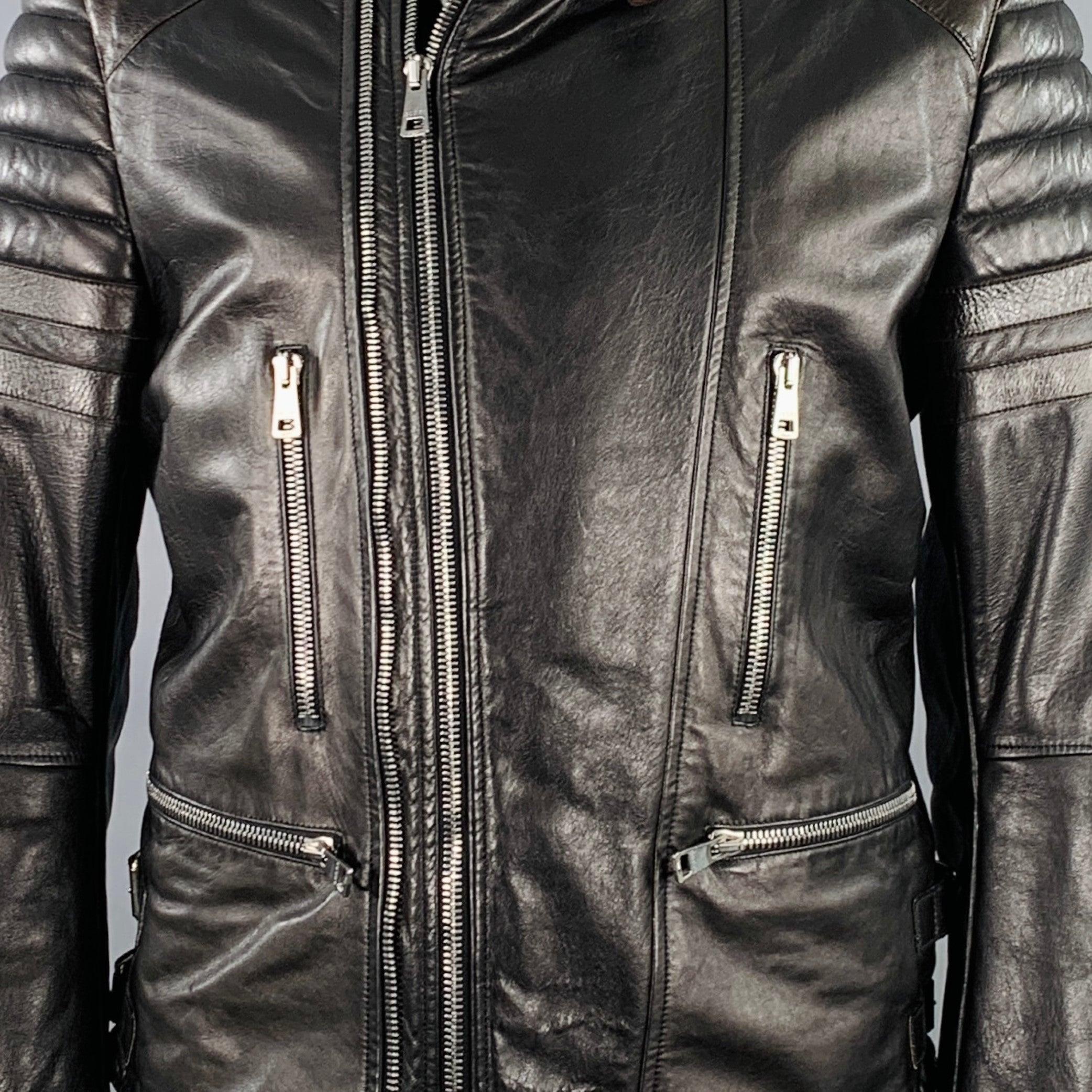 GUCCI by TOM FORD motorcycle jacket
in a black and brown leather featuring quilted shoulders, zip pockets, and zip up closure with extra zipper accent. Made in Italy.Very Good Pre-Owned Condition. Minor signs of wear. 

Marked:   IT 54