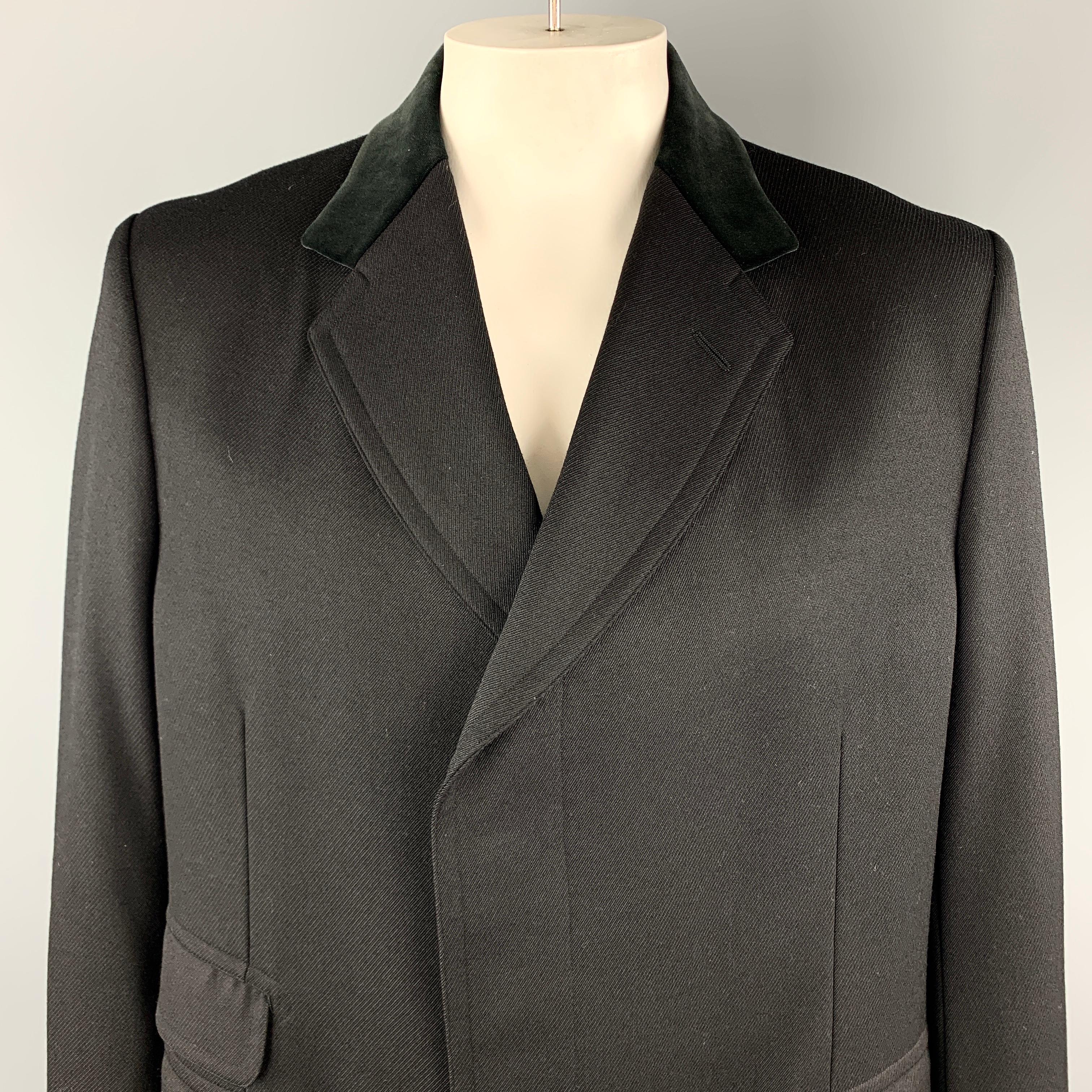 GUCCI Long Coat comes in a black solid wool material, with a velvet collar, hidden buttons at closure, single breasted, flap pockets, buttoned cuffs, and a single vent at back. Made in Switzerland. 

Excellent Pre-Owned Condition.
Marked: IT 56