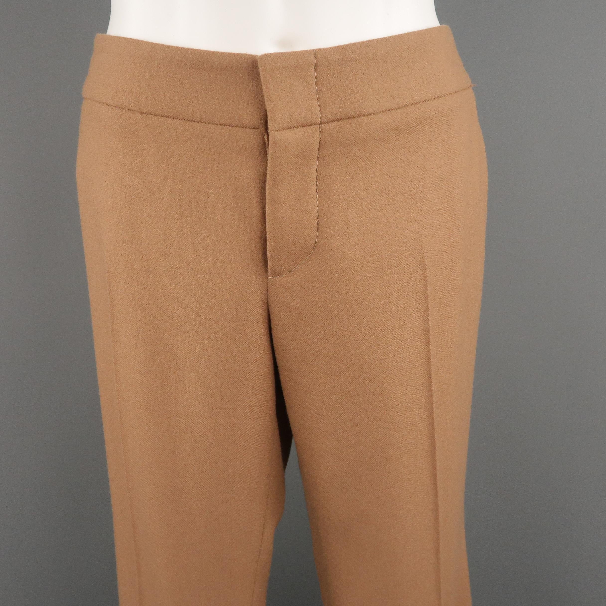 GUCCI dress pants come in camel khaki wool cashmere blend twill with a flat front, flared boot cut leg, and gold tone GG logo. Made in Italy.
 
New with Tags.
Marked: IT 42
 
Measurements:
 
Waist: 32 in.
Rise: 8 in.
Inseam:  37 in.