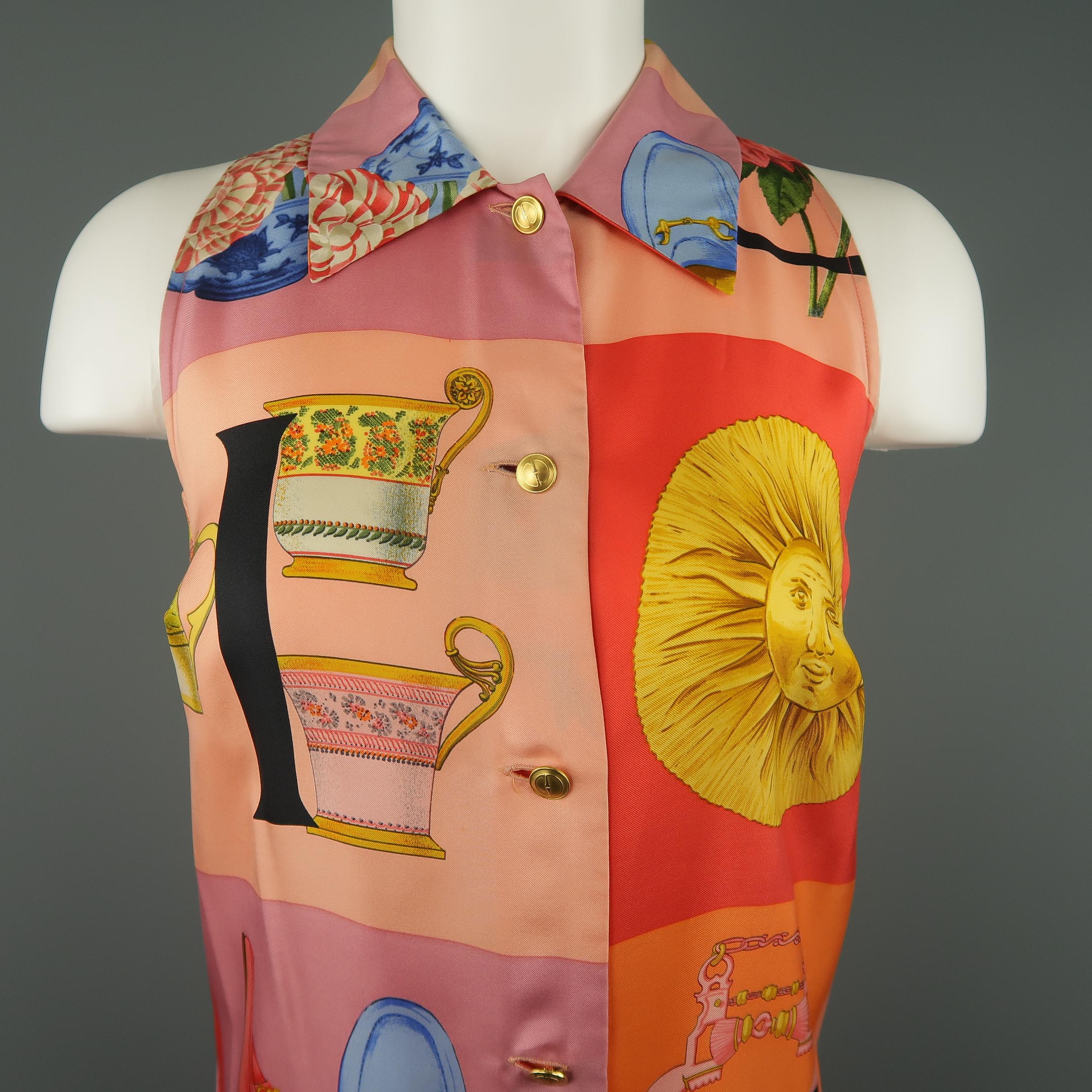 GUCCI sleeveless blouse comes in silk twill with an all over handkerchief scarf print detailed with pink, red, and orange color block panels of various graphic motifs and gold tone retro GG buttons. Minor discoloration on the front, right. Made in