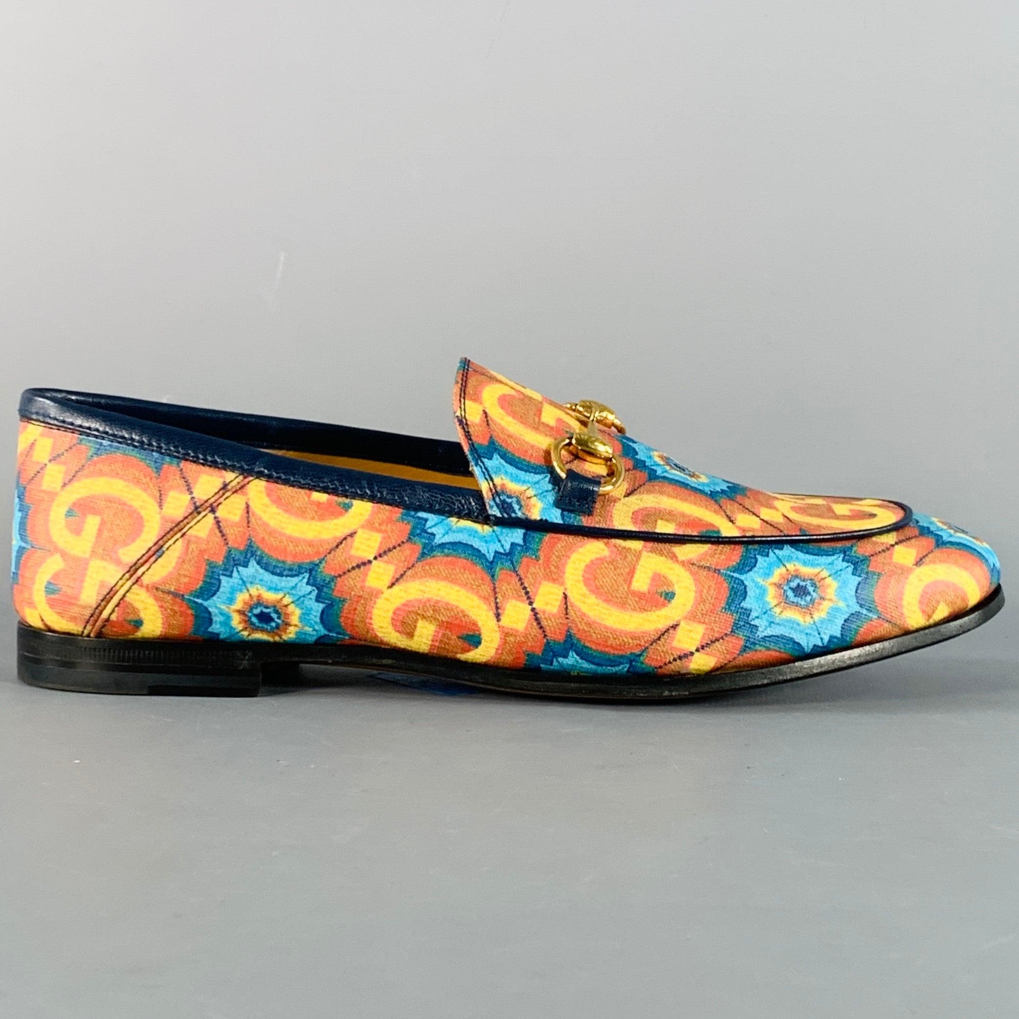 GUCCI loafers in an orange and blue coated canvas with blue leather trim featuring a vibrant Guccissima print with blue webs details, gold tone metal horsebit design, and slip on closure. Made in Italy.New without Box. 

Marked:   681285 37