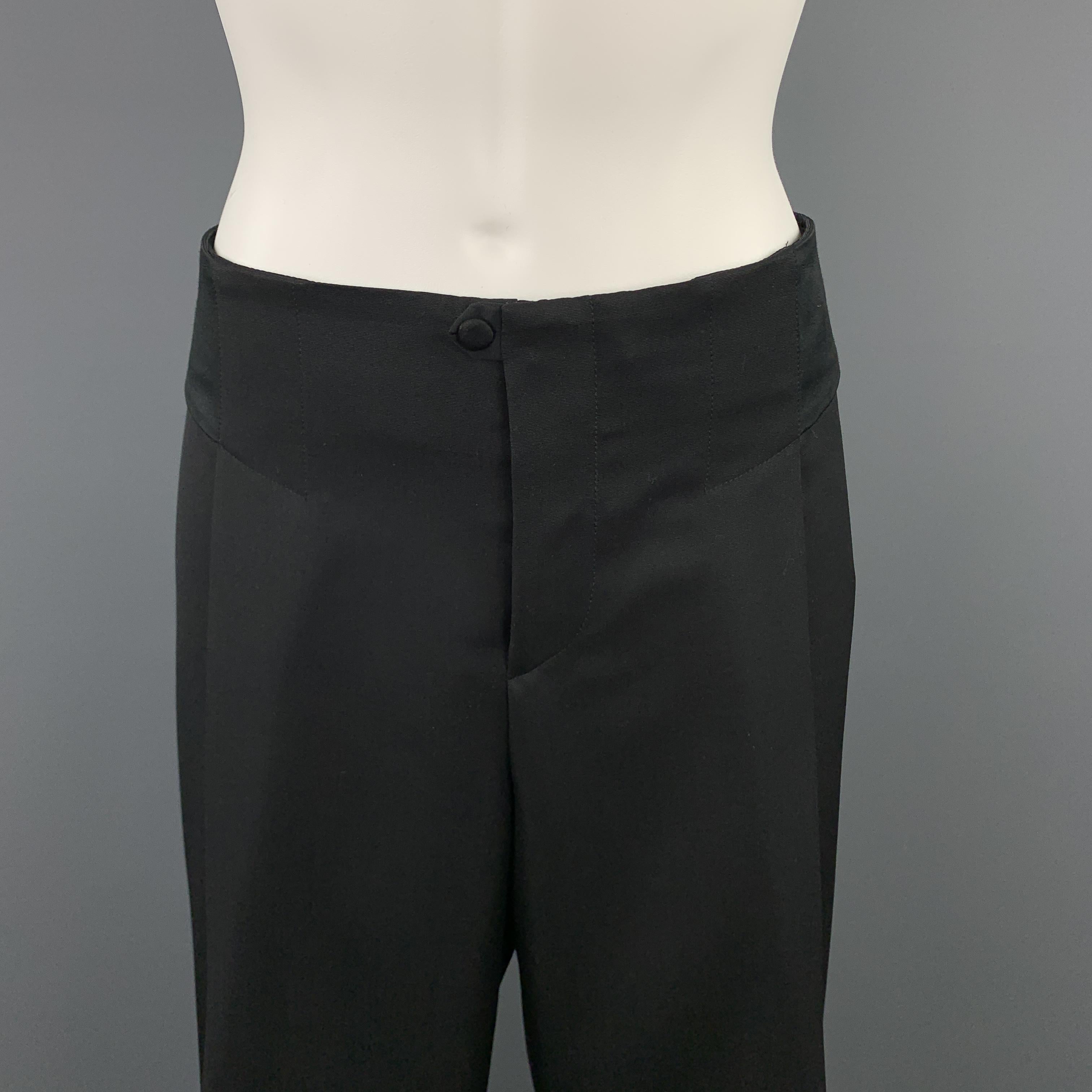 Archive GUCCI dress pants come in black wool with a single pleat wide leg, satin waistband side panels, and elastic closure at back. Elastic is a little stretched. As-is. Made in Italy.

Excellent Pre-Owned Condition.
Marked: IT