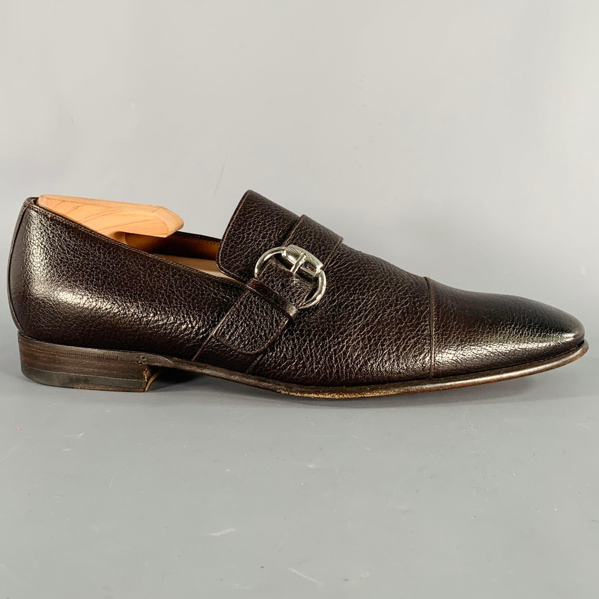 GUCCI loafers in a brown pebble grain leather featuring a square toe and a silver tone buckle. Shoe trees not included. Made in Italy. Very Good Pre-Owned Condition.
Signs of wear on soles, excellent upper condition. 

Marked:   181810 7.5DOutsole: