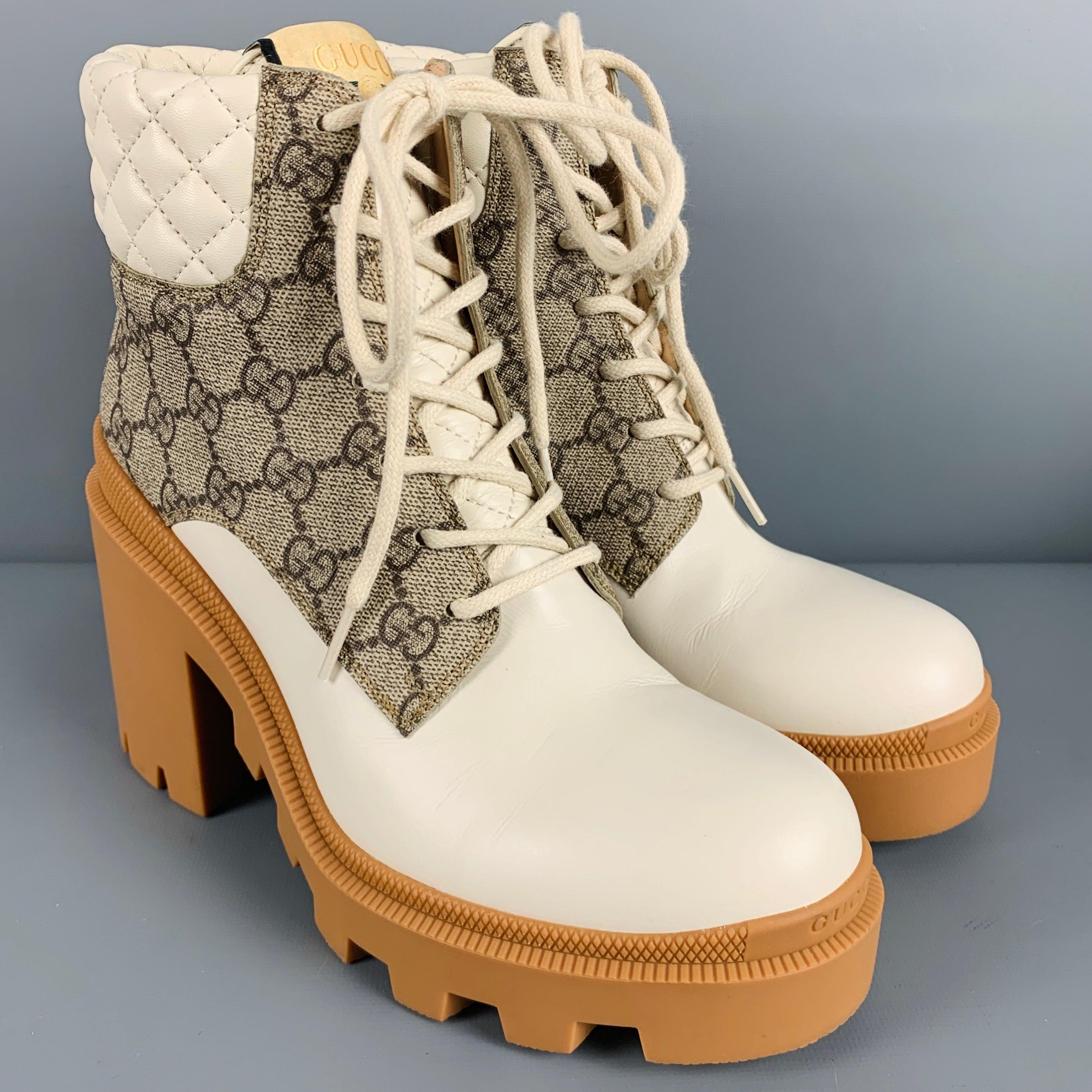 GUCCI boots
in a cream leather featuring brown GG monogram, platform style with chunky heel, and lace-up closure. Comes with box, dust bag, and extra laces. Made in Italy.Very Good Pre-Owned Condition with Box. Minor scuff marks. 

Marked:   659691