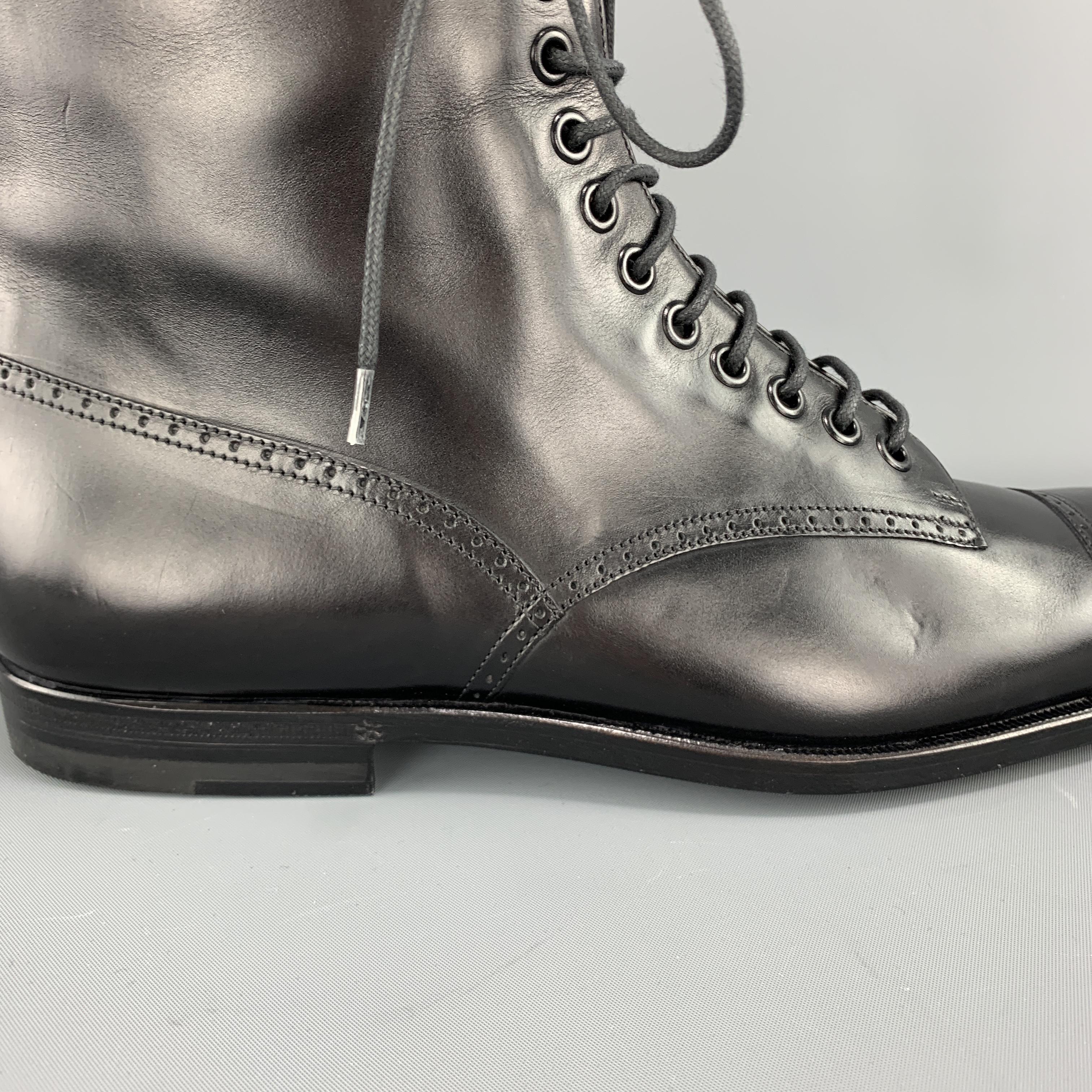 GUCCI combat style boots come in smooth black leather with perforated brogue trim and black eyelet lace up front. Made in Italy.

Brand New. 
Marked: UK 7 1/2 

Outsole: 11.5 x 3.5 in.
Height: 9.5 in. 