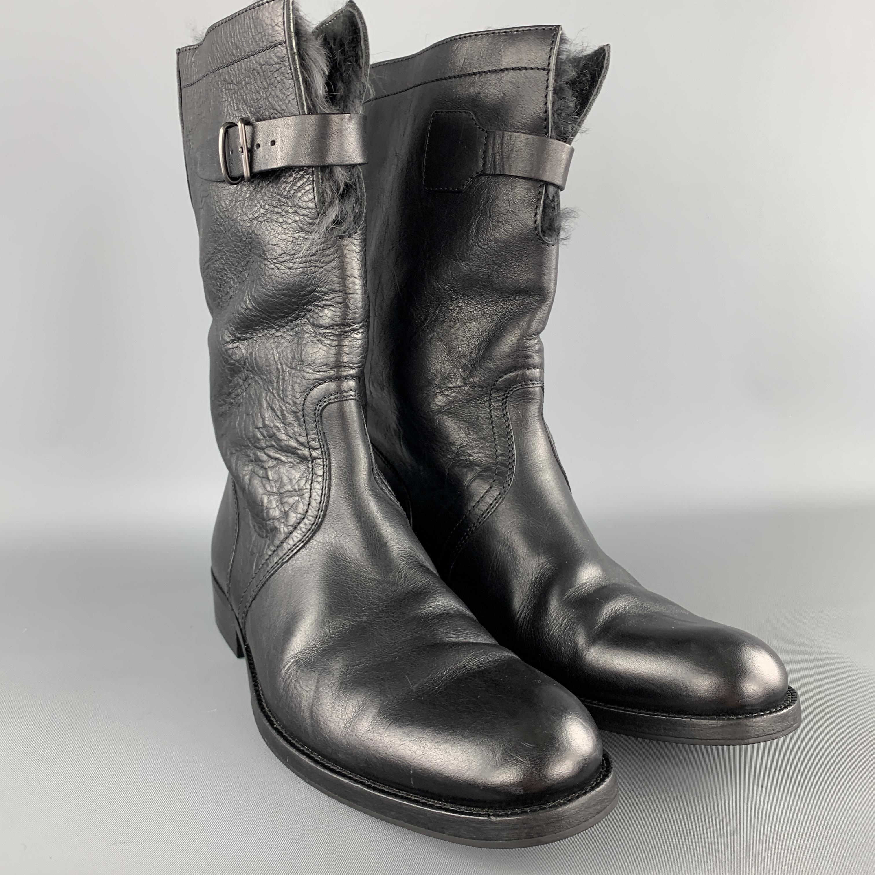 GUCCI calf length boots come in textured black leather with a buckle closure and fur liner. Made in Italy.

Excellent Pre-Owned Condition.
Marked: UK 7 1/2

Outsole: 11.75 3.75 in.
Height: 11 in.