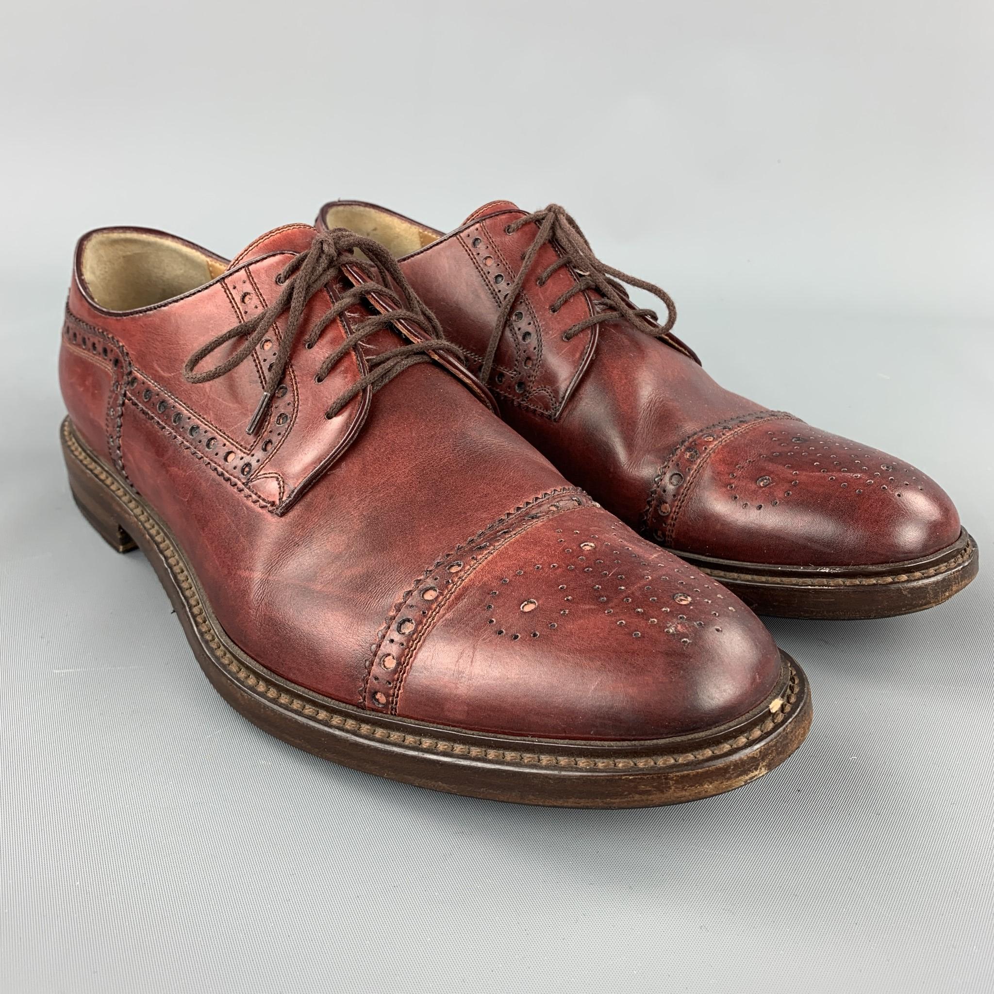 GUCCI lace up shoes comes in a burgundy perforated leather featuring a cap toe and a wooden and a wooden heel. As-Is. Made in Italy.

Very Good Pre-Owned Condition.
Marked: 8.5 

Measurements:

11.5 in. x 4 in. 