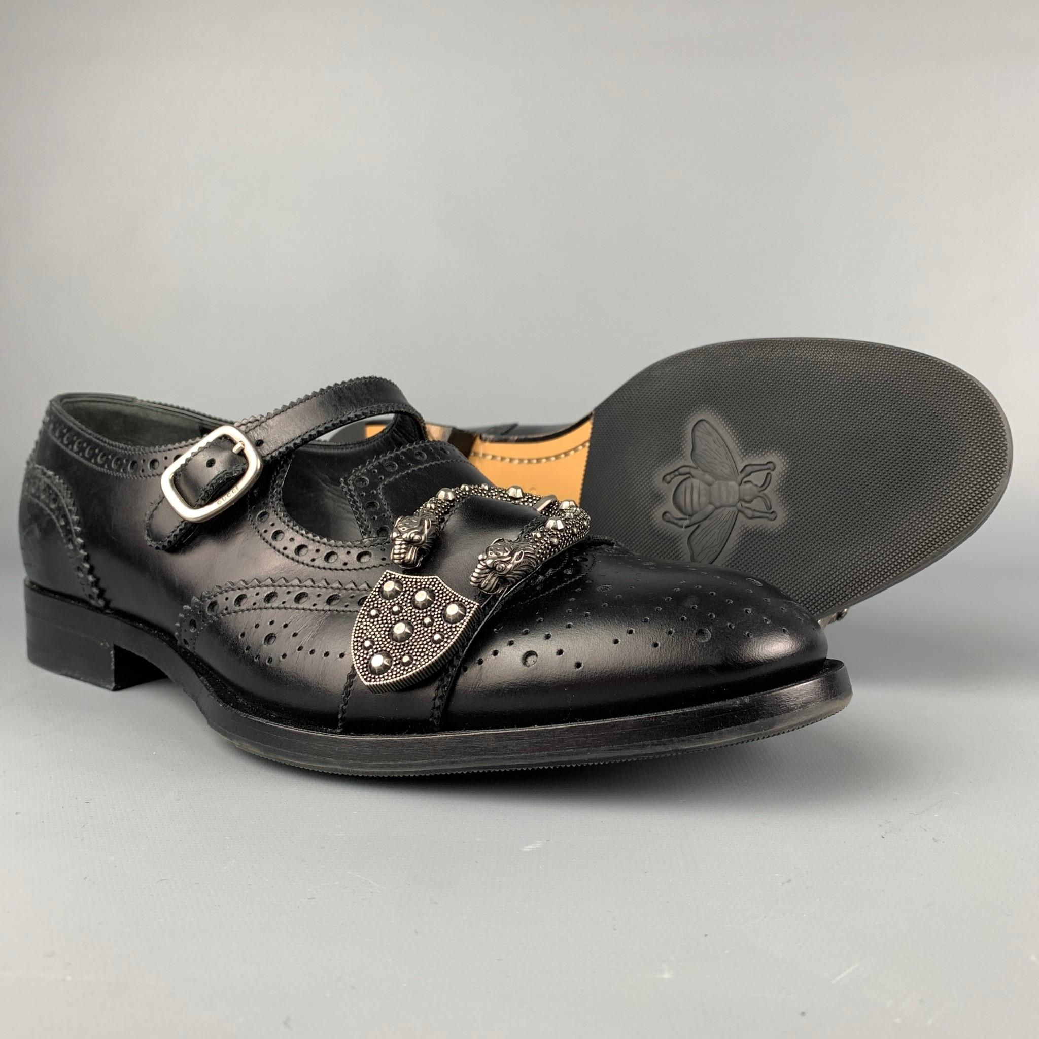 GUCCI loafers comes in a black perforated leather featuring a silver tone 