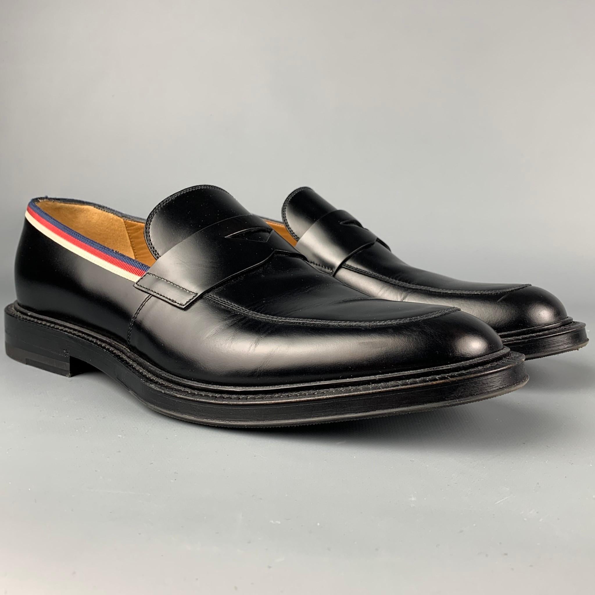 GUCCI loafers comes in a black leather featuring a round toe, ribbon trim, and a penny strap. Made in Italy. 

Very Good Pre-Owned Condition.
Marked: 473475 8.5 040
Original Retail Price: $850.00

Outsole: 12.25 in. x 4.5 in. 