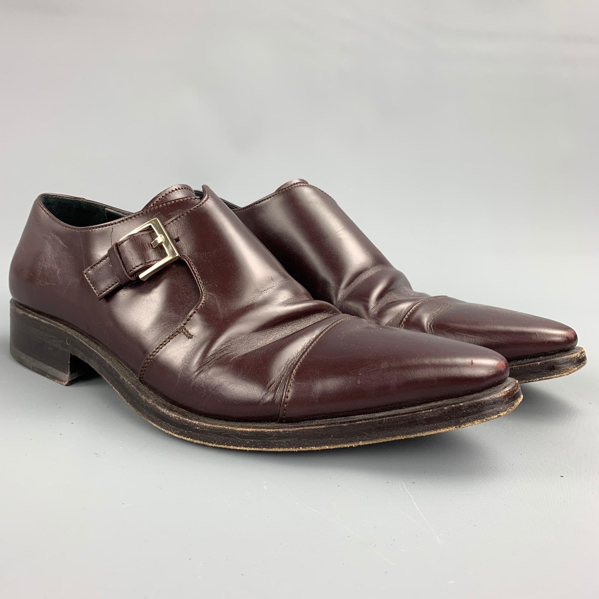 GUCCI loafers comes in a burgundy leather featuring a monk strap, pointed toe, and wooden sole. Minor wear. Made in Italy.

Good Pre-Owned Condition.
Marked: EU 42 E

Outsole:

12 in. x 4 in. 