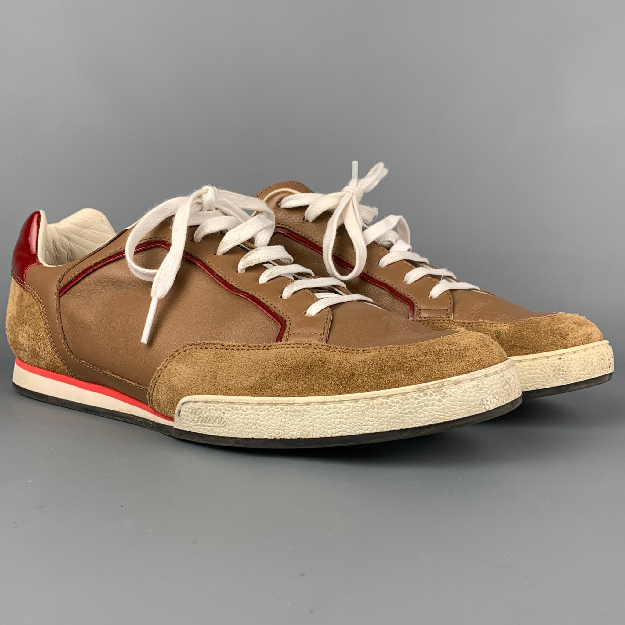 GUCCI sneakers comes in a tan & red suede featuring a patent leather trim, rubber sole, and a lace up closure. Made in Italy. 

Very Good Pre-Owned Condition.
Marked: 338786 8.5G
Original Retail Price: $650.00

Outsole: 11.25 in. x 4 in. 