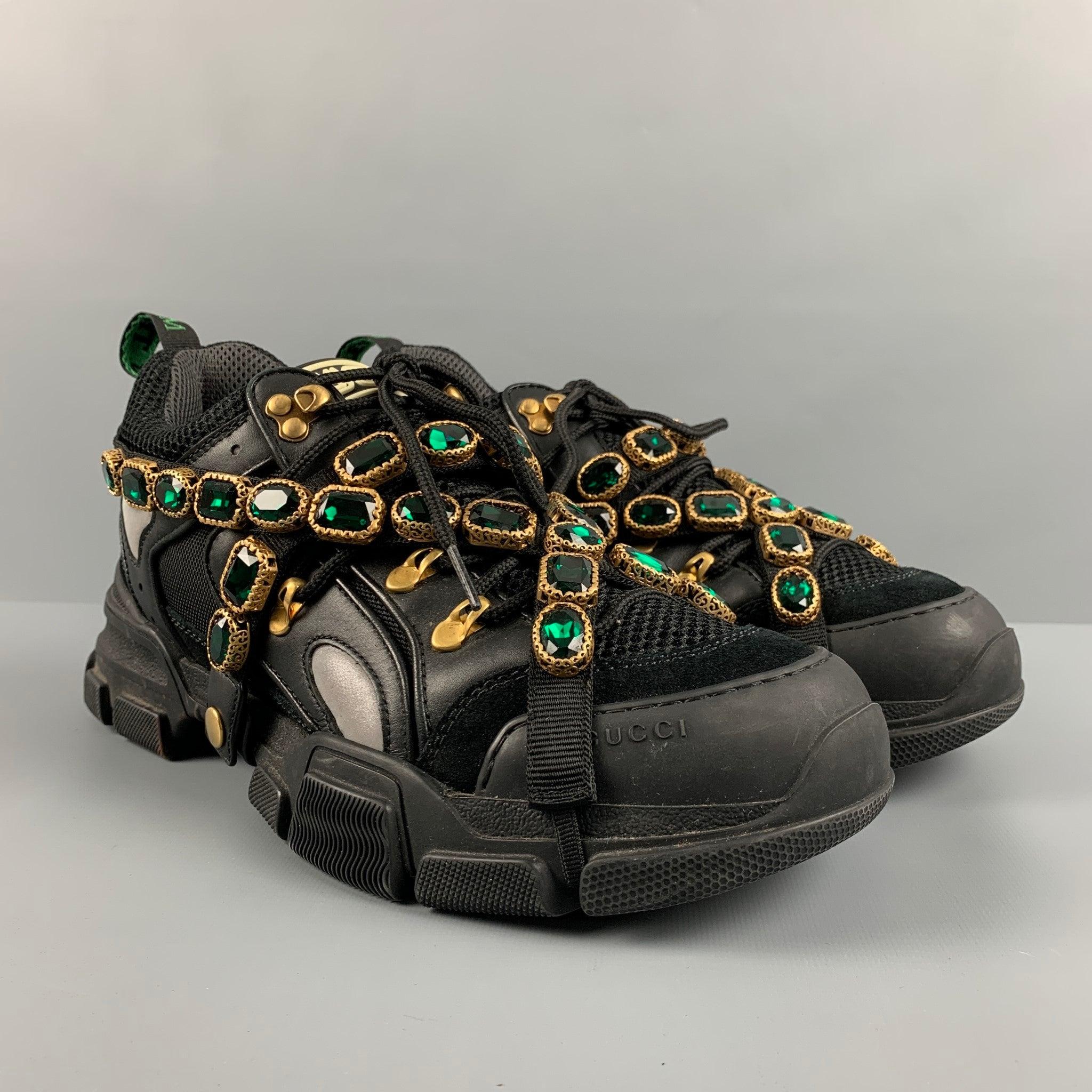 GUCCI 'Flashtrek' sneakers comes in a black nylon, leather trim, mesh panels, green heel tab, detachable green rhinestones belt straps, chunky midsole, and a lace up closure. Made in Italy.Very Good Pre-Owned Condition.
Moderate Signs of wear.