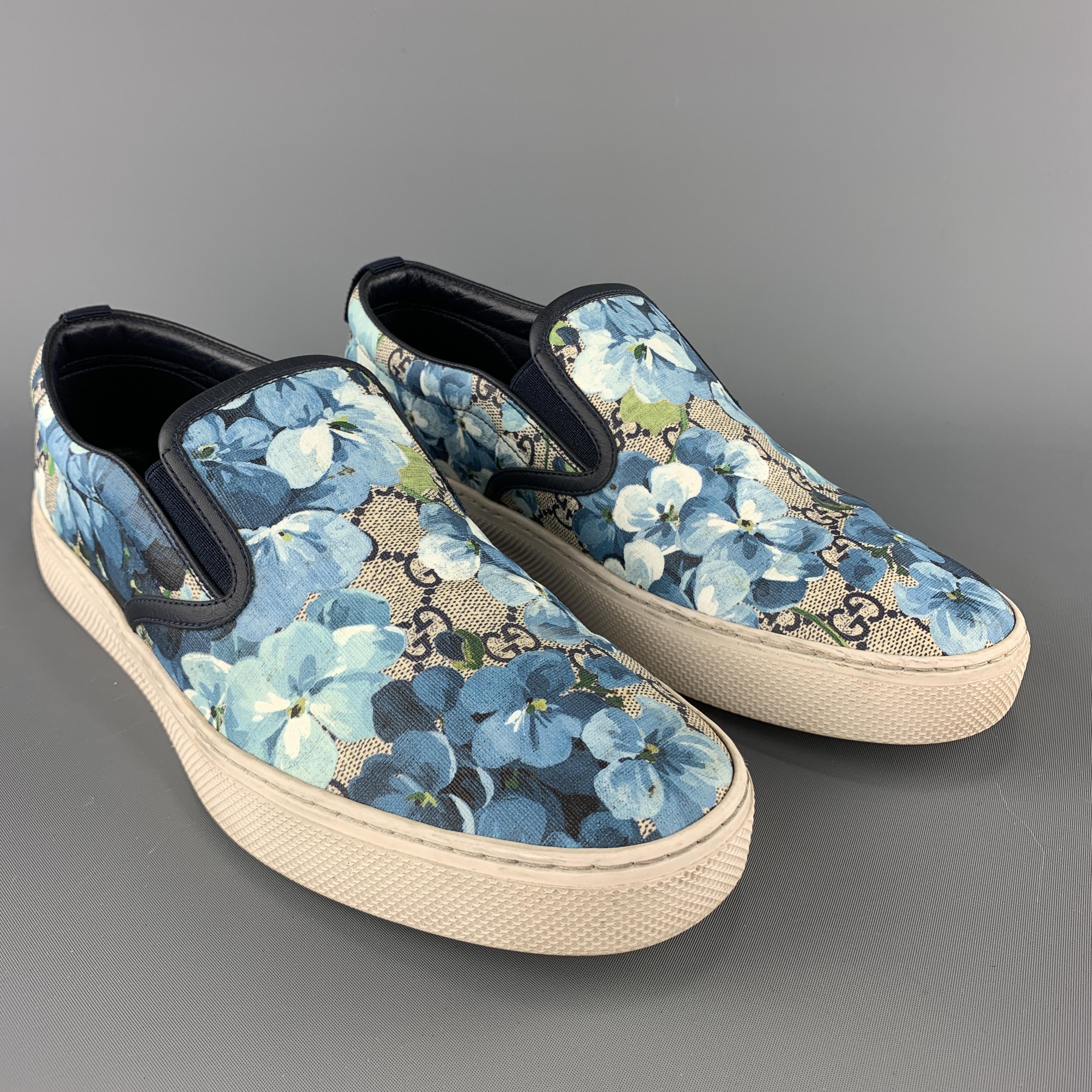 GUCCI slip on sneakers come in beige monogram coated canvas with blue blooms floral print throughout, navy leather trim, and white rubber sole. Minor wear. As-is. Made in Italy.
 

Good Pre-Owned Condition.
Marked: UK 8.5

Outsole: 11.5 x 4.75 in.