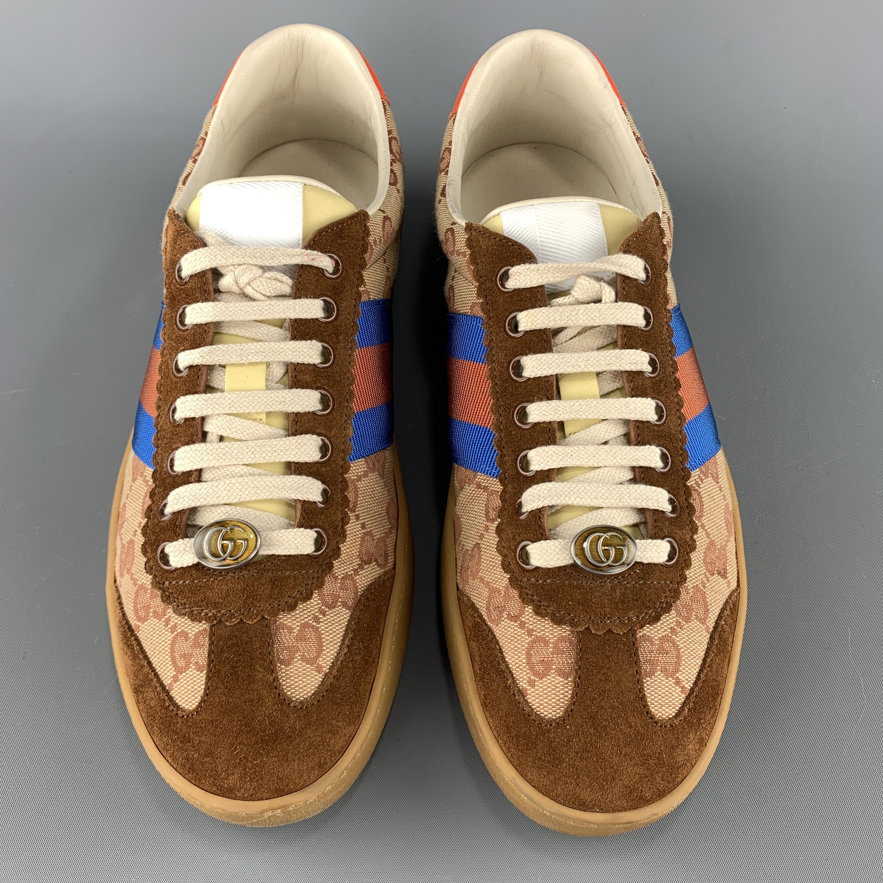 GUCCI G74 low top sneakers come in tan and beige monogram canvas with suede panels, lace up front with GG enamel accent, red leather heel with bee stamp, and tan rubber sole.  Made in Italy.

Excellent Pre-Owned Condition.
Marked: UK 8.5

Outsole: