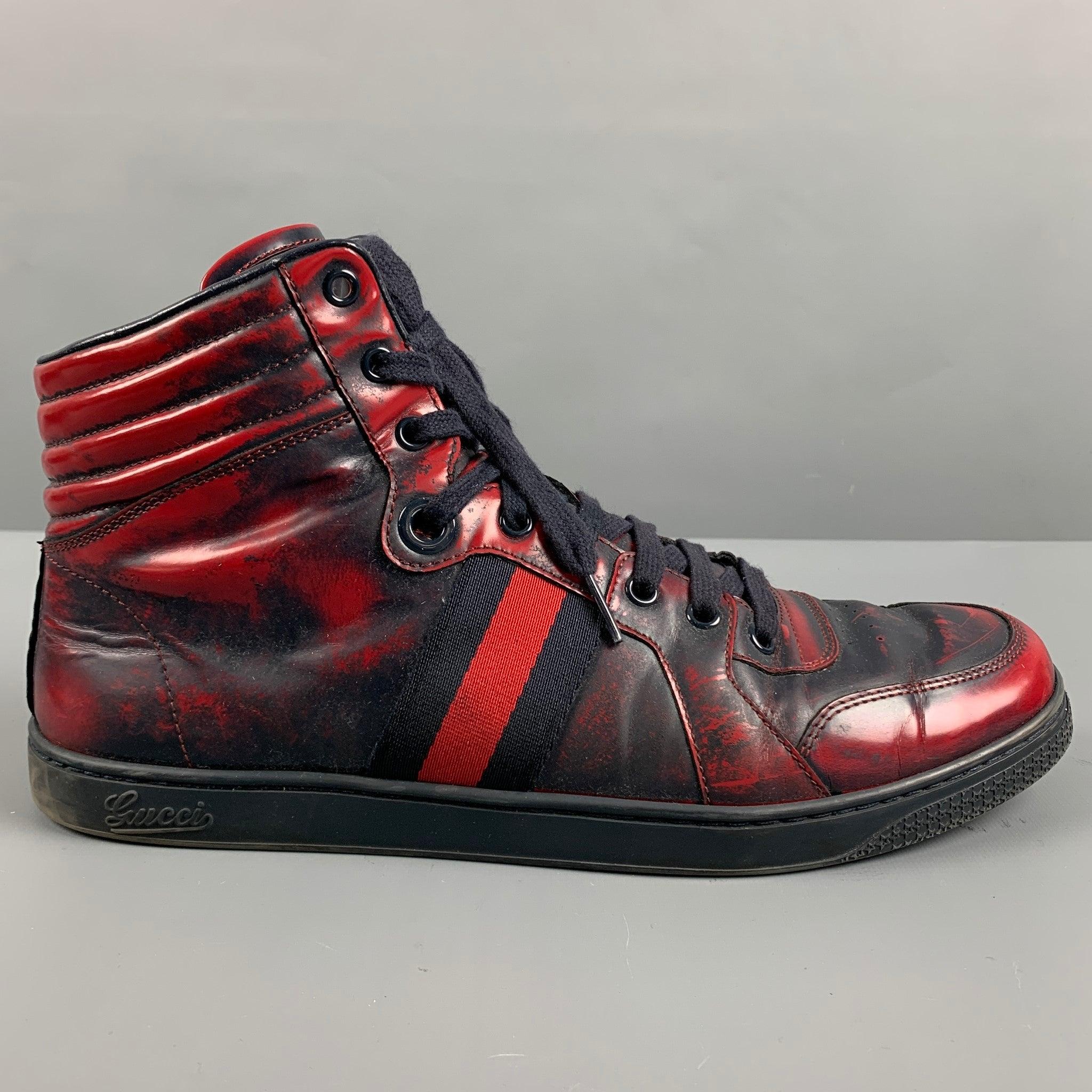 GUCCI sneakers
in a red and navy leather featuring a high top style, marbled pattern, signature Gucci stripes, and lace-up closure. Made in Italy.Very Good Pre-Owned Condition. Minor signs of wear. 

Marked:   283533 9 GOutsole: 11.5 inches  x 4 in

