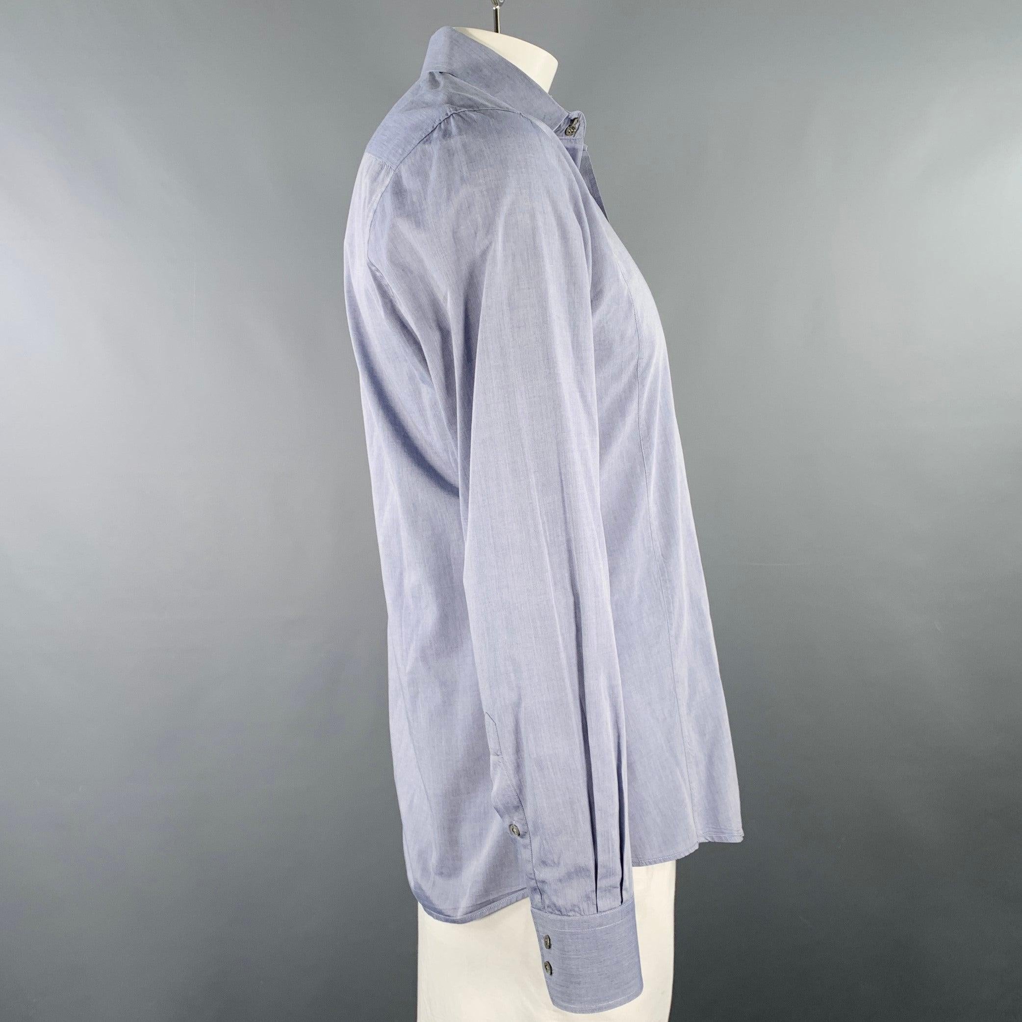 GUCCI long sleeve shirt
in a blue grey woven fabric (feels like cotton) featuring a fitted style, spread collar, and button closure. Made in Italy.Excellent Pre-Owned Condition. Fabric tags removed. 

Marked:   42/16.5 

Measurements: 
 
Shoulder: