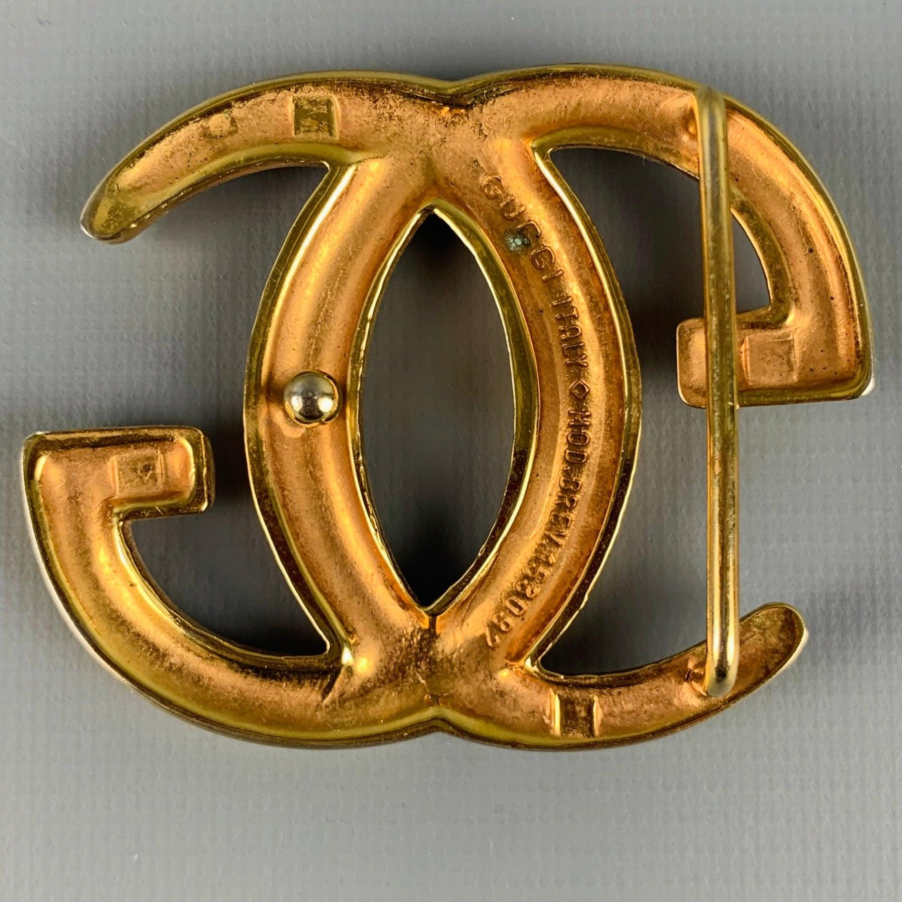 GUCCI
belt buckle in a gold tone metal featuring GG monogram, and belt loop. Made in Italy.Very Good Pre-Owned Condition. Minor signs of wear. 

Measurements: 
  9.5 cm. x 8.5 cm.
  
  
 
Sui Generis Reference: 129567
Category: Belt Buckle
More
