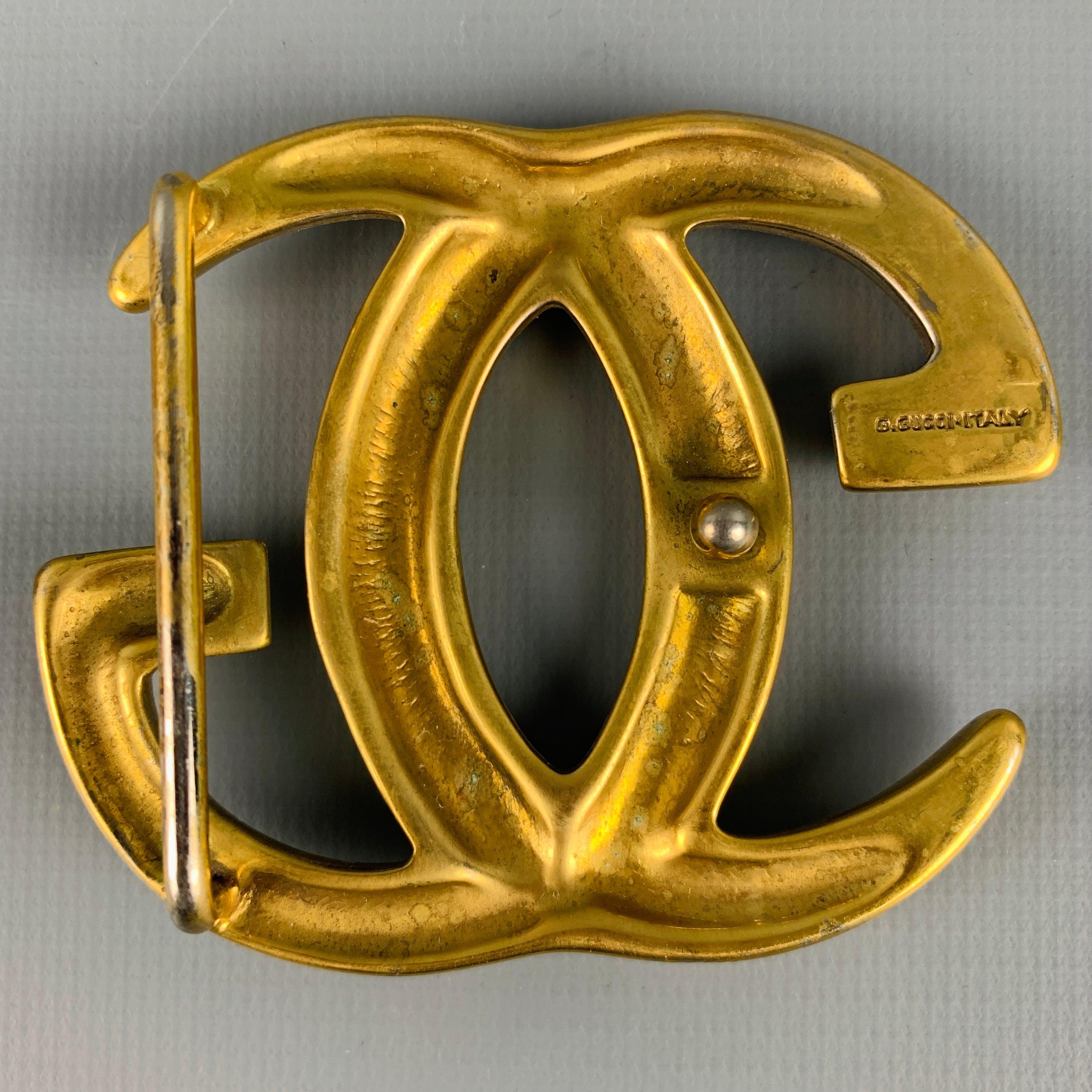 GUCCI
belt buckle in a gold tone metal featuring GG monogram, and belt loop. Made in Italy.Very Good Pre-Owned Condition. Minor signs of wear. 

Measurements: 
  9.5 cm. x 8.5 cm.

  
  
 
Sui Generis Reference: 129565
Category: Belt Buckle
More