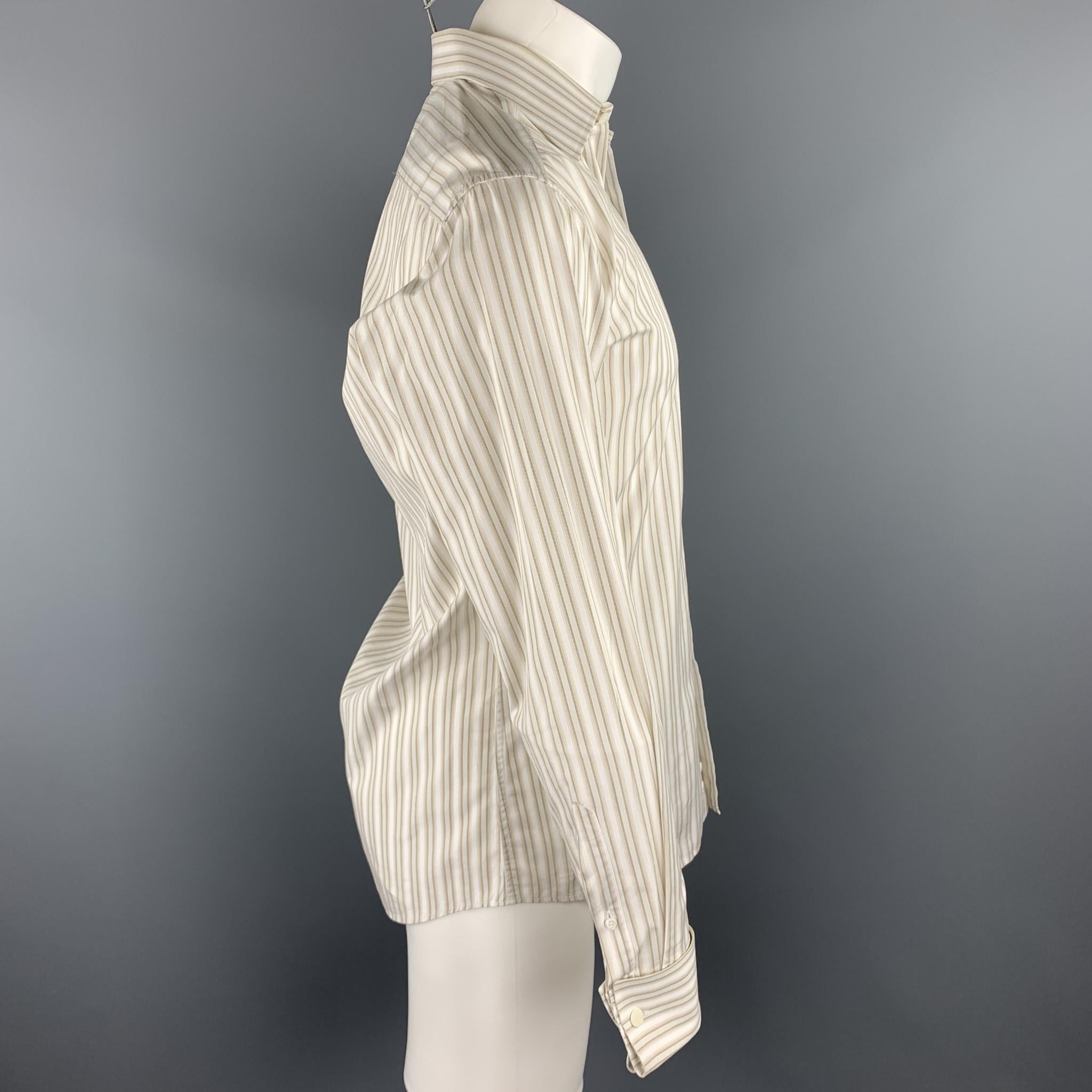 GUCCI long sleeve shirt comes in a beige stripe cotton featuring a button up style, french cuffs, and a spread collar. Cufflinks not included. Discoloration on collar. As-Is. Made in Italy.

Good Pre-Owned Condition.
Marked: