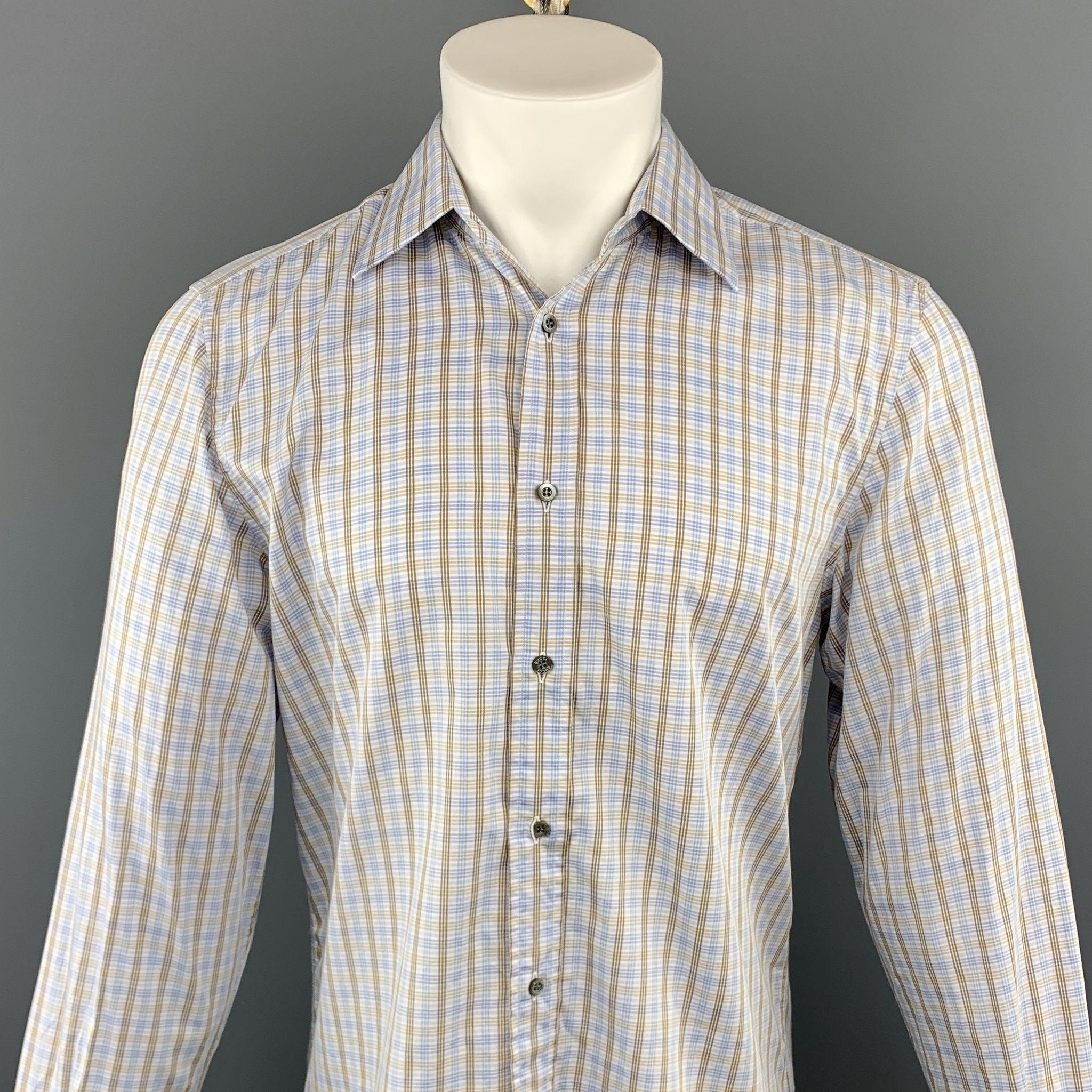GUCCI long sleeve shirt comes in a blue and brown plaid cotton featuring a button up style and a spread collar. Made in Italy.
 
Excellent Pre-Owned Condition.
Marked: 41
 
Measurements:
 
Shoulder: 17 in.
Chest: 44 in.
Sleeve: 27 in.
Length: 27 in.