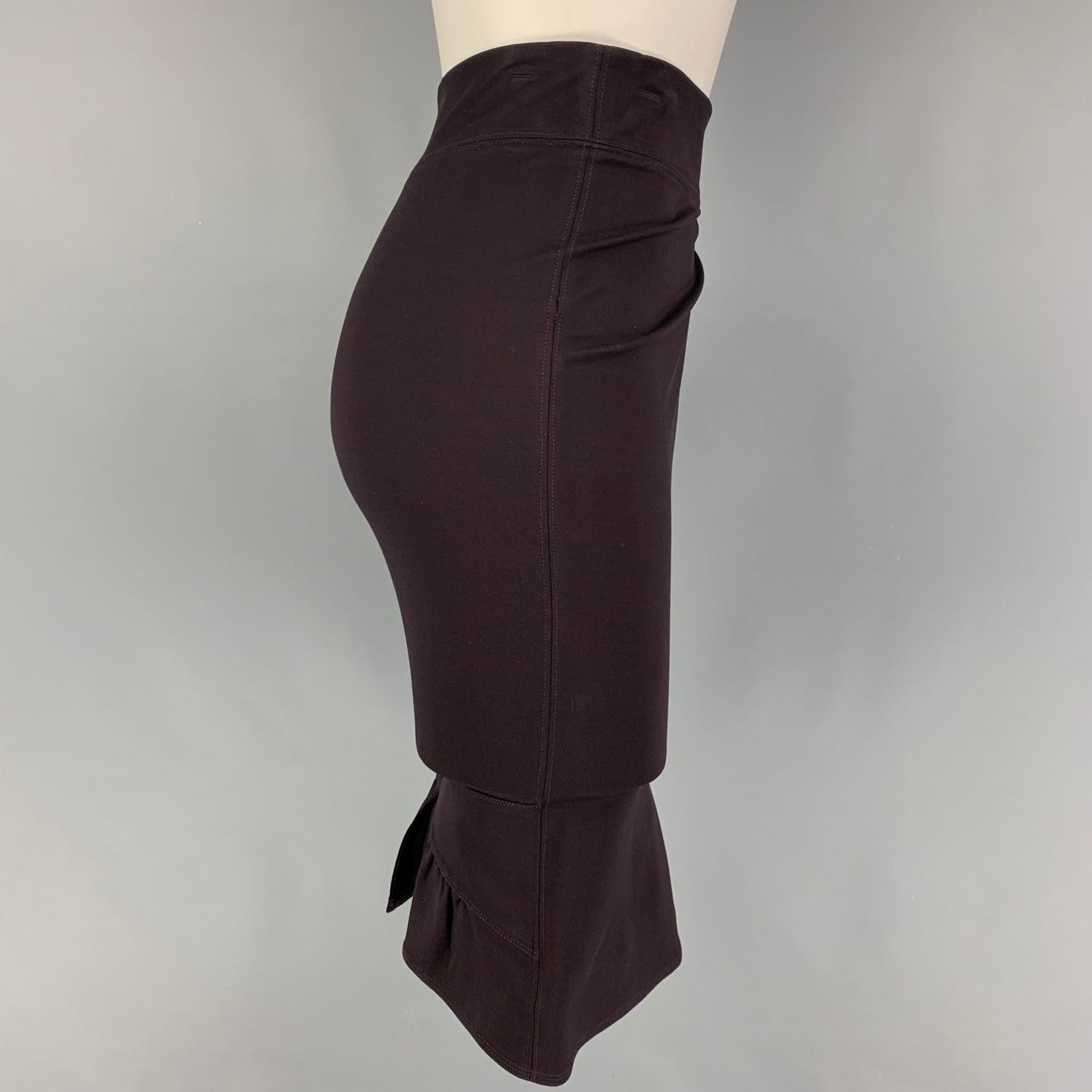 GUCCI skirt comes in a eggplant viscose blend featuring a back ruffle design, small back slit, and a side zipper closure. Made in Italy.
Very Good
Pre-Owned Condition. 

Marked:   M  

Measurements: 
  Waist: 29 inches  Hip:
33 inches  Length: 23